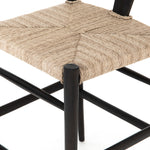 Featuring Muestra Counter + Bar Stool - Black Teak by Four Hands at Amethyst Home. Modern curves redefine the classic wishbone-style of this Muestra Black Teak Counter + Bar Stool. Vintage white all-weather wicker is woven for a dose of fresh texture within weathered grey teak framing. Cover or store indoors during inclement weather and when not in use.
Count.  Amethyst Home provides interior design, new home construction design consulting, vintage area rugs, and lighting in the Austin metro area.