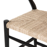 Featuring Muestra Counter + Bar Stool - Black Teak by Four Hands at Amethyst Home. Modern curves redefine the classic wishbone-style of this Muestra Black Teak Counter + Bar Stool. Vintage white all-weather wicker is woven for a dose of fresh texture within weathered grey teak framing. Cover or store indoors during inclement weather and when not in use.
Co.  Amethyst Home provides interior design, new home construction design consulting, vintage area rugs, and lighting in the Charlotte metro area.