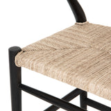 Featuring Muestra Counter + Bar Stool - Black Teak by Four Hands at Amethyst Home. Modern curves redefine the classic wishbone-style of this Muestra Black Teak Counter + Bar Stool. Vintage white all-weather wicker is woven for a dose of fresh texture within weathered grey teak framing. Cover or store indoors during inclement weather and when not in use.
Co.  Amethyst Home provides interior design, new home construction design consulting, vintage area rugs, and lighting in the Charlotte metro area.
