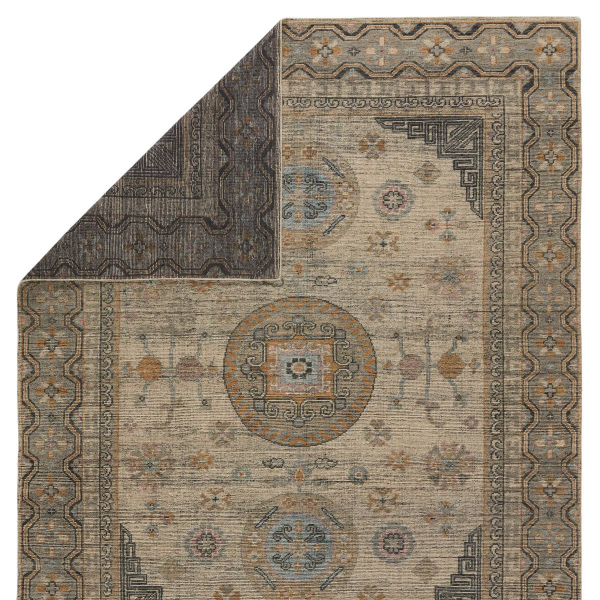 The Rhapsody Delpha Area Rug by Jaipur Living, or RHA05, boasts a beautiful medallion motif with a tile-like, decorative border detail. The light ivory tone is accented with rich green-blue, ochre, and sky blue hues. This durable wool hand knotted rug is perfect for the living room or other high traffic areas. 