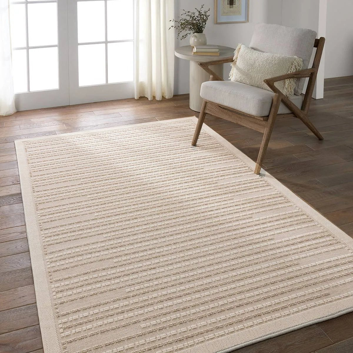 The Continuum collection brings the classic sisal look to outdoor spaces and high-traffic indoor areas. The soft Axiom design features an abstract, geometric pattern with cream high-low pile for added dimension. The polypropylene fibers are stain and water resistant for an easy-care accent piece that suits any area of the home Amethyst Home provides interior design, new home construction design consulting, vintage area rugs, and lighting in the Dallas metro area.