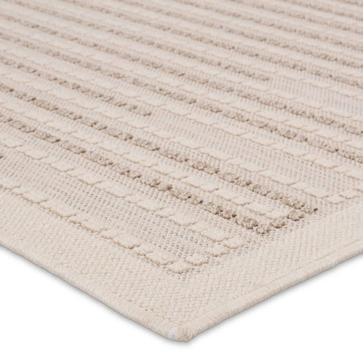 The Continuum collection brings the classic sisal look to outdoor spaces and high-traffic indoor areas. The soft Axiom design features an abstract, geometric pattern with cream high-low pile for added dimension. The polypropylene fibers are stain and water resistant for an easy-care accent piece that suits any area of the home Amethyst Home provides interior design, new home construction design consulting, vintage area rugs, and lighting in the Des Moines metro area.