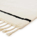 The Desouk collection melds modern allure with the global vibes of Morocco. The Vendace hand-knotted rug showcases a geometric linear pattern with contrasting black and cream tones. Amethyst Home provides interior design services, furniture, rugs, and lighting in the Miami metro area.