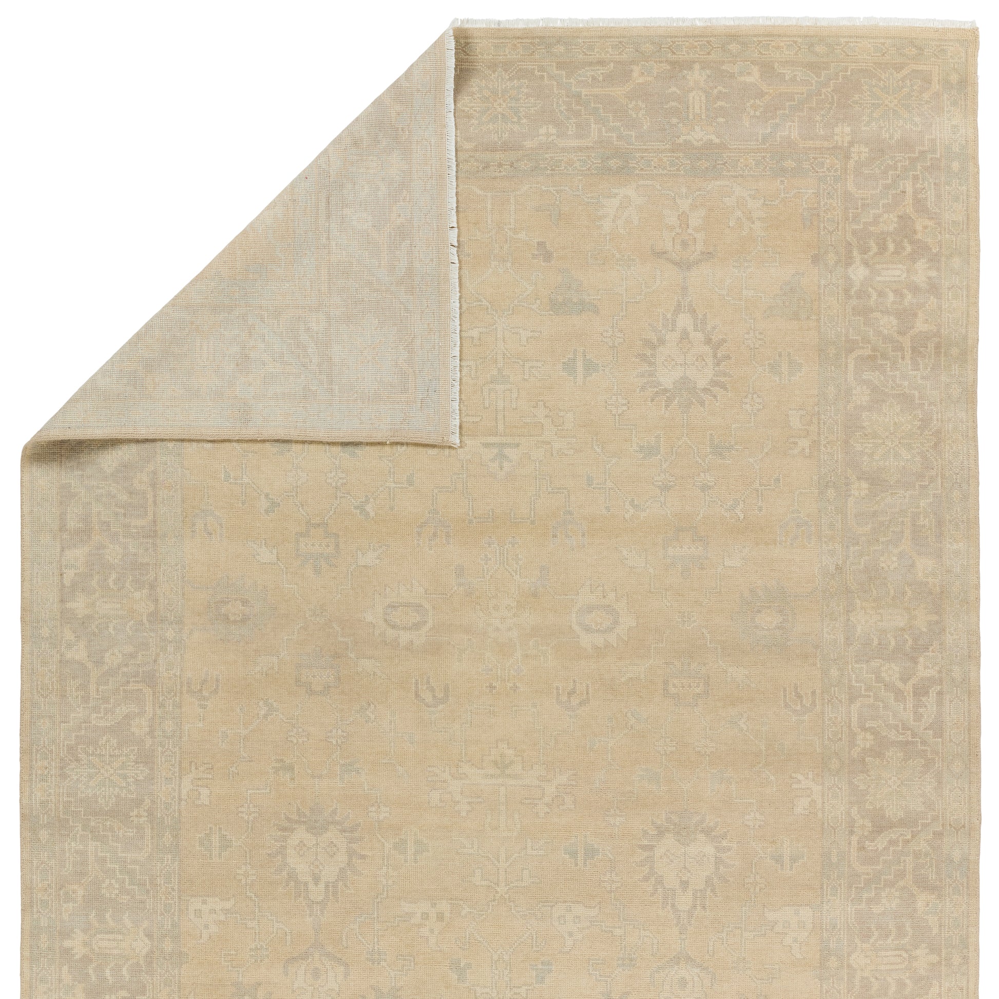 The Eloquent collection emanates traditional elegance, lending a soft and serene look to transitional homes. The Verity area rug features a faded Oushak design cream, gray, and light sage tones. This hand-knotted wool and viscose rug grounds living spaces with a classic, earthy look. Amethyst Home provides interior design, new construction, custom furniture, and area rugs in the Salt Lake City metro area.