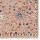 The updated traditional Everly collection features Oushak-inspired designs in whimsical color palettes. The Matera design features a sweet colorway of pink, yellow, navy, cream, peach, and taupe. This hand-knotted wool rug anchors living spaces with a fresh take on vintage style. The low, easy-care pile delights in both high and low traffic areas of the home.  Amethyst Home provides interior design, new construction, custom furniture, and area rugs in the Washington metro area.