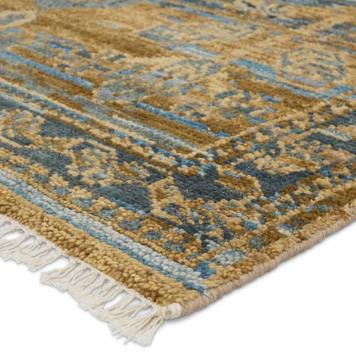 The hand-knotted Jinsen Fontane features a fresh incarnation of the vintage Turkish textile look. Classic in pattern and modern in color, the Fontane rug boasts a beautiful palette of tan, blue, gold, and brown, featuring distinct dye-lot details and subtle fringe. Amethyst Home provides interior design, new home construction design consulting, vintage area rugs, and lighting in the Alpharetta metro area.