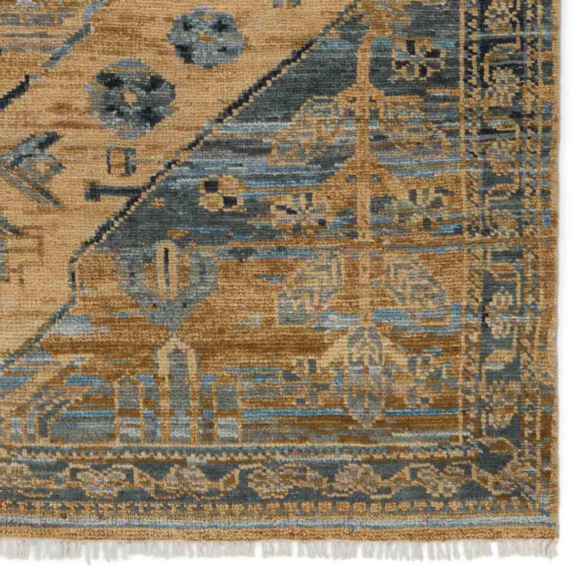 The hand-knotted Jinsen Fontane features a fresh incarnation of the vintage Turkish textile look. Classic in pattern and modern in color, the Fontane rug boasts a beautiful palette of tan, blue, gold, and brown, featuring distinct dye-lot details and subtle fringe. Amethyst Home provides interior design, new home construction design consulting, vintage area rugs, and lighting in the Tampa metro area.