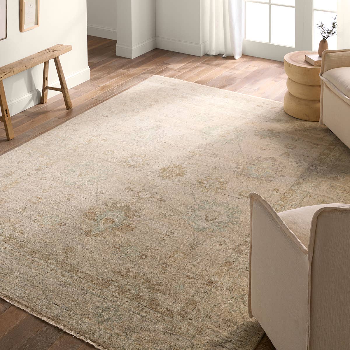The Orenda Kerensa features heirloom-quality designs of muted and uniquely updated Old World patterns. The Kerensa area rug boasts a beautifully washed medallion motif with an antique Oushak-inspired vibe. The ivory tone is accented with cool blue and warm beige hues for added depth and intrigue. Amethyst Home provides interior design, new home construction design consulting, vintage area rugs, and lighting in the Newport Beach metro area.