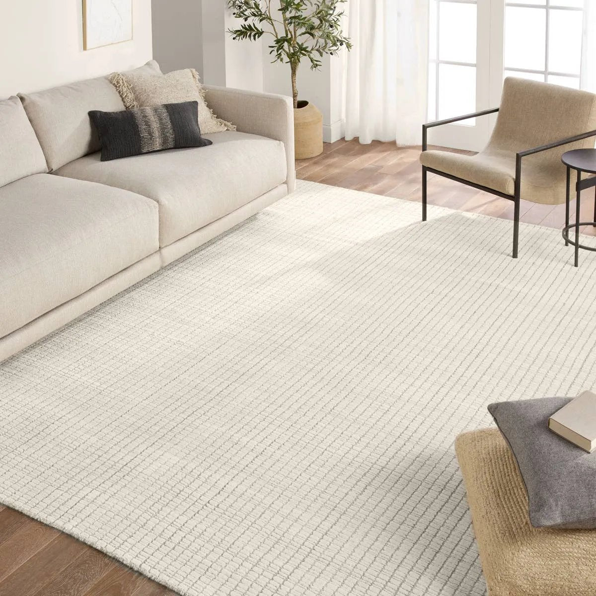 Handwoven in India, the Park City Sundance by Barclay Butera evokes a masculine modernity through neutral-toned grids. The modern Sundance rug showcases a grid in on-trend hues of cream and gray. The cut and looped pile adds texture while maintaining a soft hand. Amethyst Home provides interior design, new home construction design consulting, vintage area rugs, and lighting in the Nashville metro area.