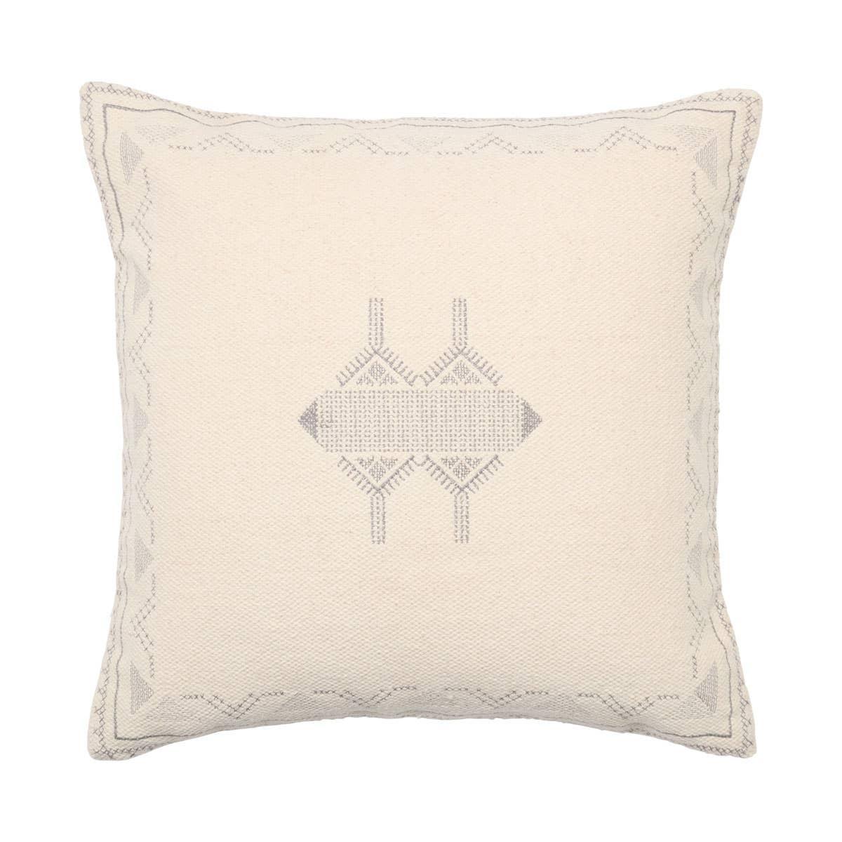 Inspired by Moroccan Sabra styles, the Puebla Ianira boasts vibrant color palettes and intricate tribal embroidery. The Ianira throw pillow features a cream colorway with a silvery medallion and tribal details accenting the textural, cotton weave. This indoor accent pillow delights in any modern home.Indoor Pillow Amethyst Home provides interior design, new home construction design consulting, vintage area rugs, and lighting in the Dallas metro area.