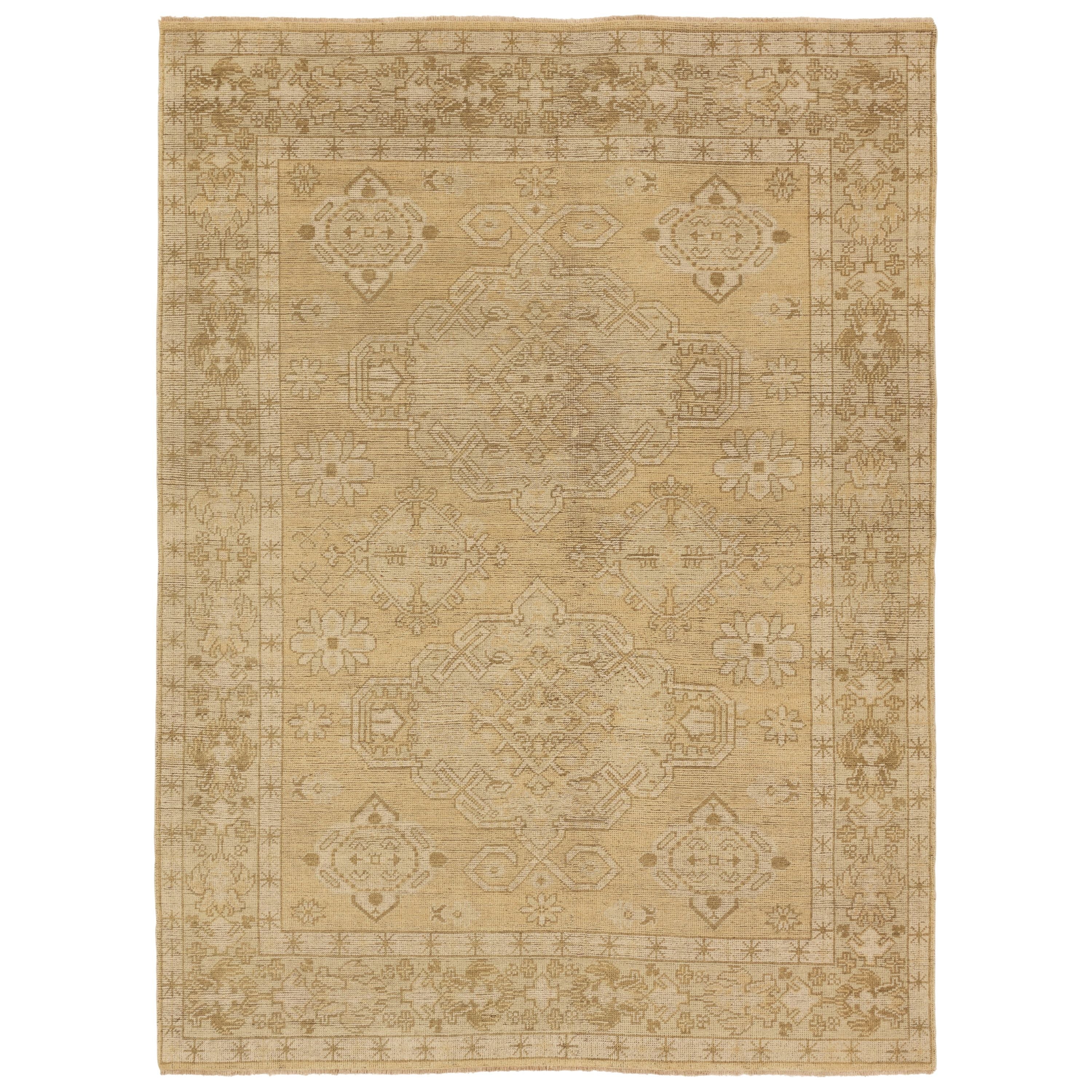 The Rhapsody collection features heirloom-quality designs of stunningly abrashed Old World patterns. The Folklore area rug boasts a beautifully washed medallion motif with a decorative border. The khaki tones are accented with cream and taupe hues for added depth and intrigue. This durable wool handknot anchors living spaces with a fresh take on vintage style. Amethyst Home provides interior design, new construction, custom furniture, and area rugs in the Nashville metro area.