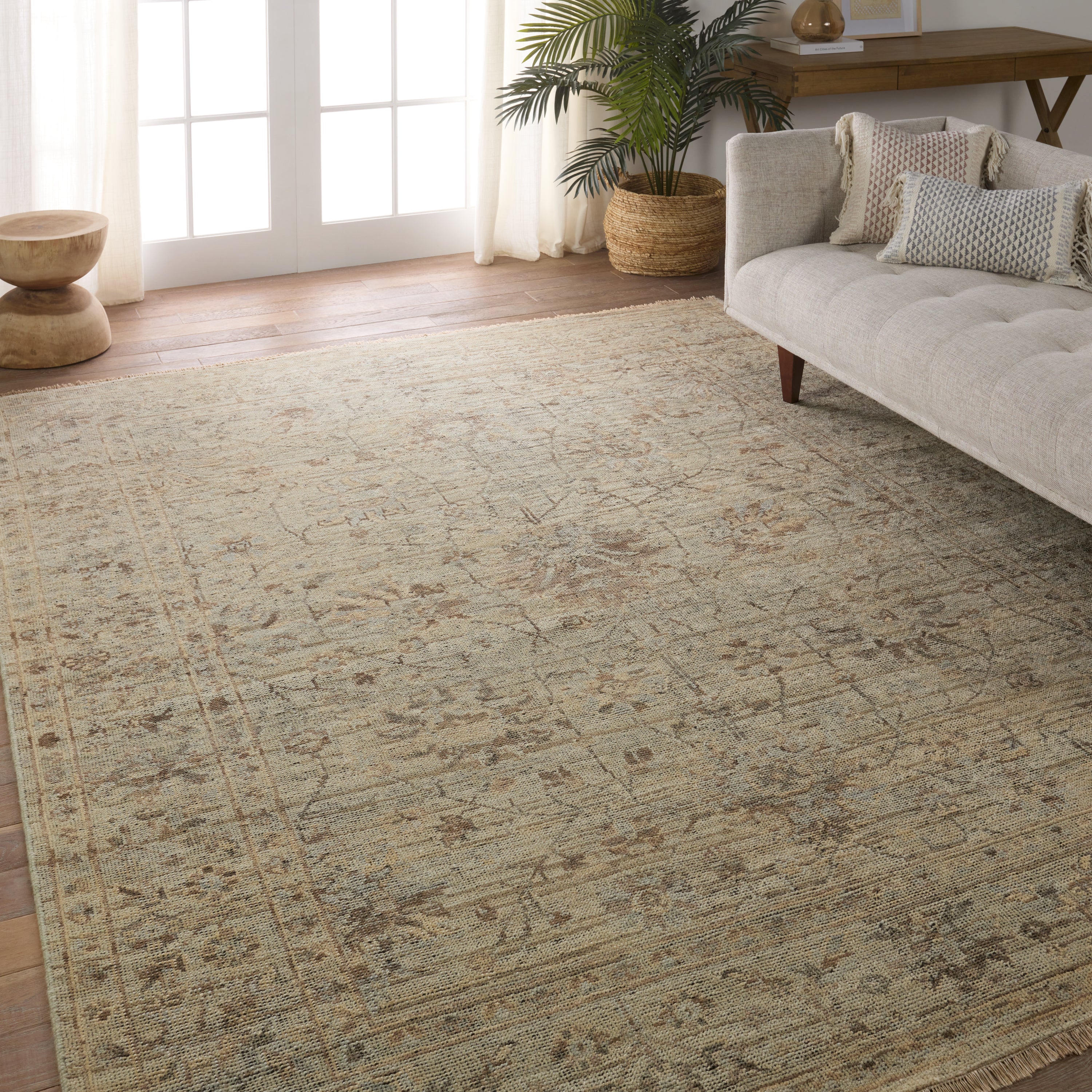 Featuring Rhapsody Tilda Hand-Knotted Rug by Jaipur Living at Amethyst Home. The Rhapsody collection features heirloom-quality designs of stunningly abrashed Old World patterns. The Tilda area rug boasts a beautifully washed floral motif with a decorative border. The green tones are accented with tan and gray hues for added depth and intrigue. This durable wool handknot ancho. Amethyst Home provides interior design, new construction, custom furniture, and area rugs in the Newport Beach metro area.