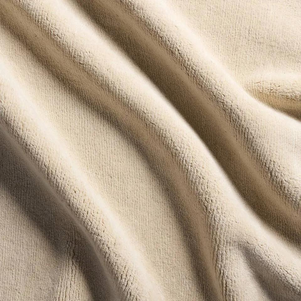 Made from the exceptional soft fleece and durability of Alpaca and New Zealand Wool, the Si Blanc Theia creates uniform excellence as the understated centerpiece of a room. With its natural luster and timeless charm the Theia design made of cream Tibetan hand knots brings simple and soft sophistication underfoot.?Hand Knotte Amethyst Home provides interior design, new home construction design consulting, vintage area rugs, and lighting in the Winter Garden metro area.