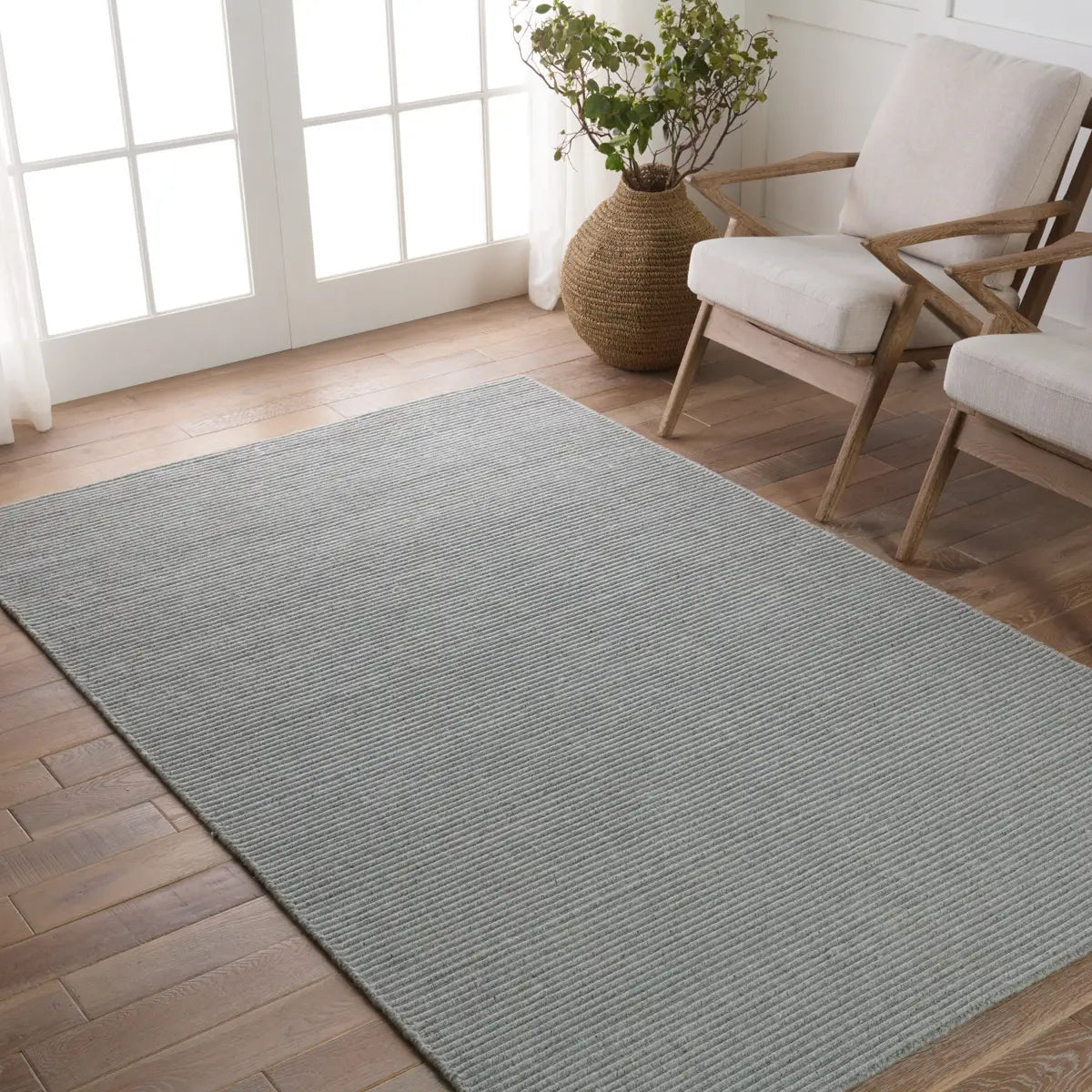 The Strada Shyre Blue Rug features a unique texture and casual comfort that effortlessly grounds spaces with a solid hue. This handwoven wool rug is crafted from undyed yarn for a distinctive, neutral colorway with natural variation for a bit of dimension. Amethyst Home provides interior design services, furniture, rugs, and lighting in the Kansas City metro area.