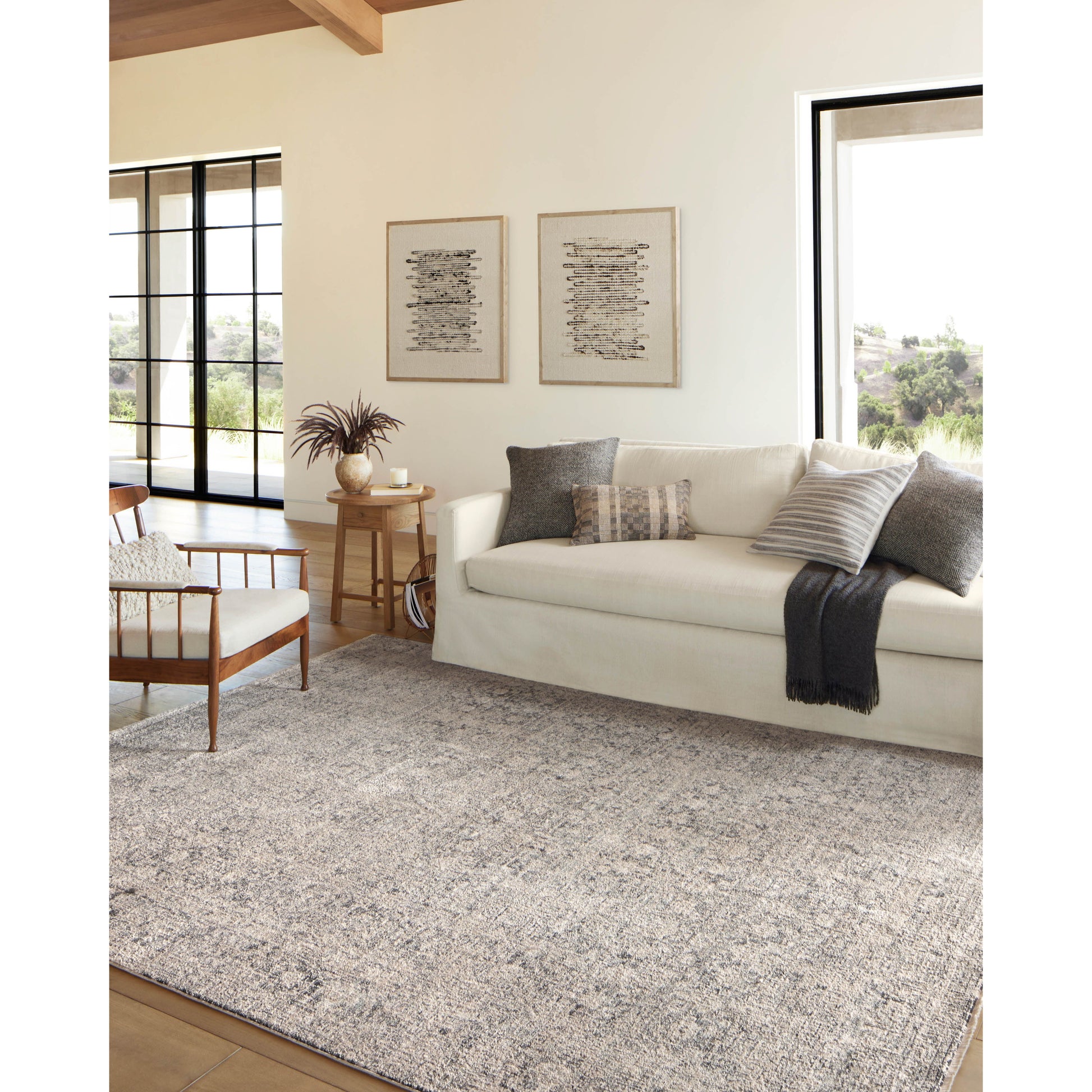 Amber Lewis x Loloi Alie Stone / Mist Rug have an elevated antique look and plush, modern feel. The rug’s underlying traditional motif is overlaid with a slightly higher pile that creates a softening effect like early morning fog. Amethyst Home provides interior design services, furniture, rugs, and lighting in the Austin metro area.