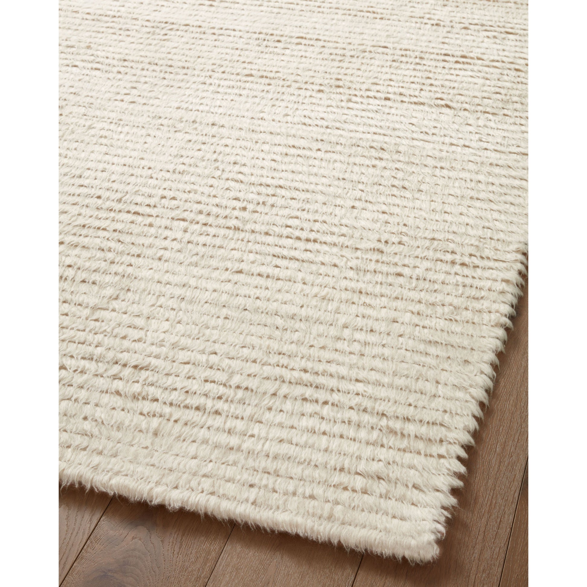 The Amber Lewis x Loloi Woodland Ivory Rug has a lush, soft pile inspired by the tree-lined city of Woodland, California. A slightly ridged construction adds dimension and movement to this stylish, modern rug. Amethyst Home provides interior design services, furniture, rugs, and lighting in the Kansas City metro area.