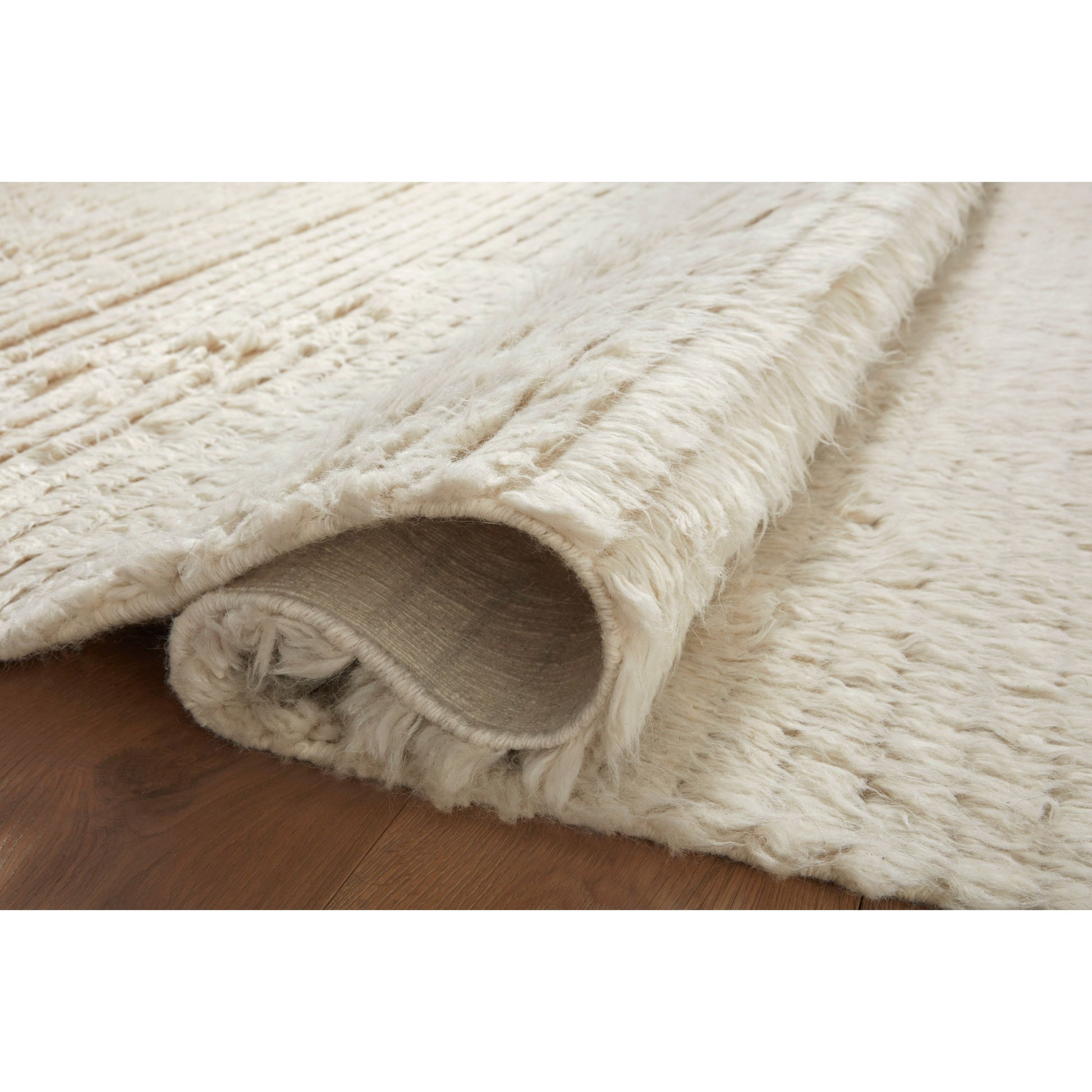 The Amber Lewis x Loloi Woodland Ivory Rug has a lush, soft pile inspired by the tree-lined city of Woodland, California. A slightly ridged construction adds dimension and movement to this stylish, modern rug. Amethyst Home provides interior design services, furniture, rugs, and lighting in the Seattle metro area.