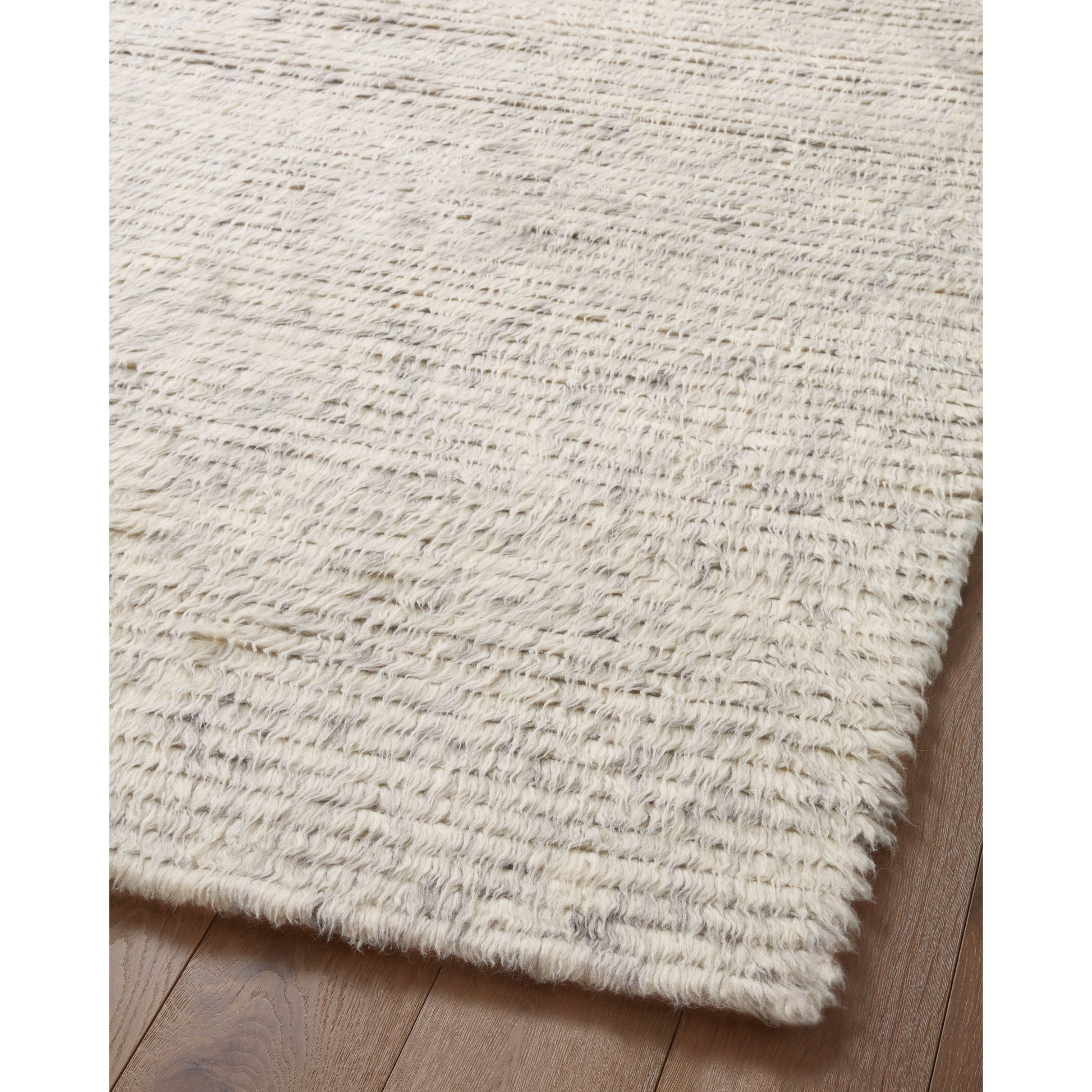The Amber Lewis x Loloi Woodland Silver Rug has a lush, soft pile inspired by the tree-lined city of Woodland, California. A slightly ridged construction adds dimension and movement to this stylish, modern rug. Amethyst Home provides interior design services, furniture, rugs, and lighting in the Kansas City metro area.