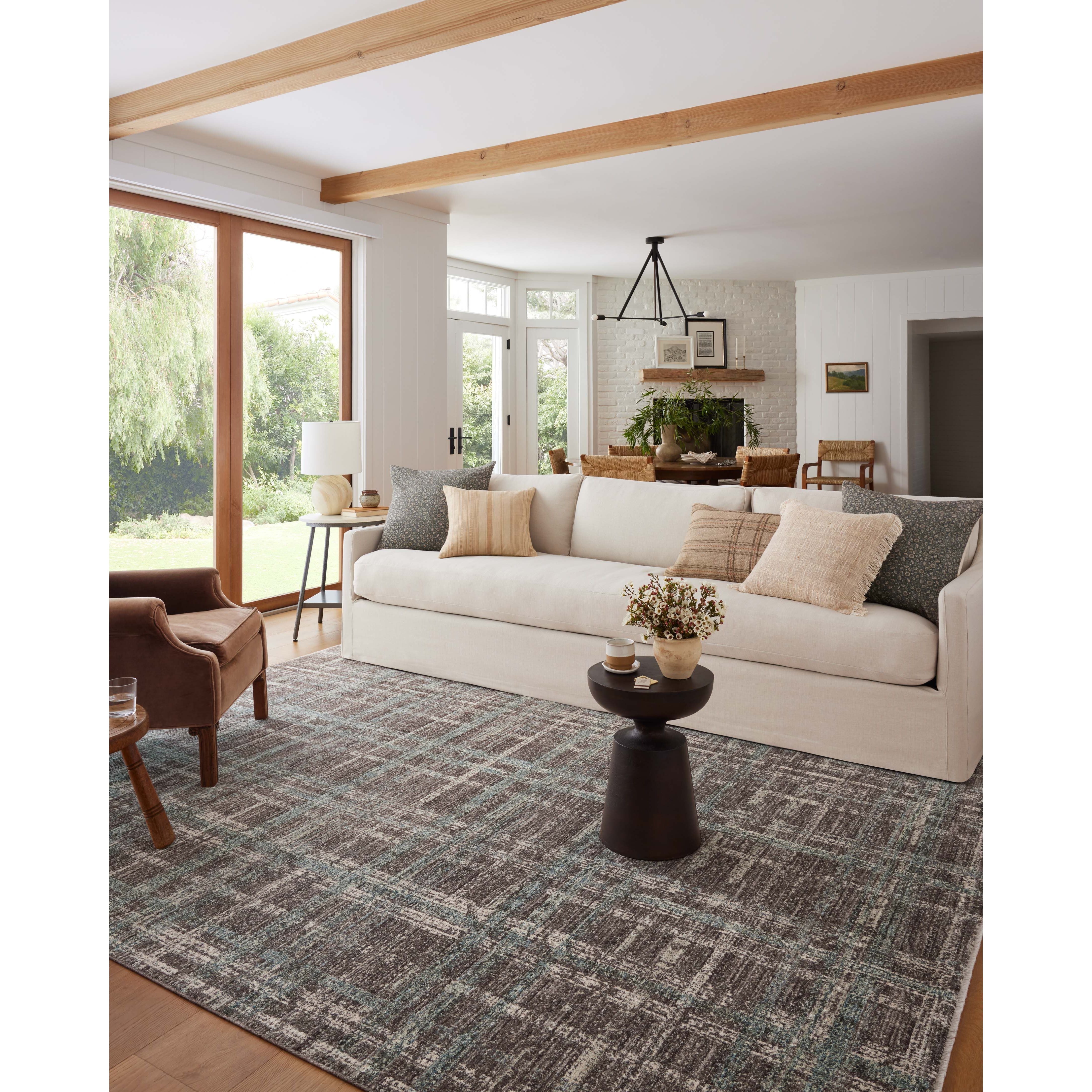 Featuring Angela Rose x Loloi Ember Espresso / Multi Rug by Loloi at Amethyst Home. The Ember Espresso / Multi rug by Angela Rose x Loloi is a modern flatweave area rug with a timeless plaid pattern that adds depth and coziness to any living room, bedroom, dining room, or hallway. Ember is power-loomed of 100% space-dyed polyester, a durable construction th. Amethyst Home provides interior design, new home construction design consulting, vintage area rugs, and lighting in the Charlotte metro area.