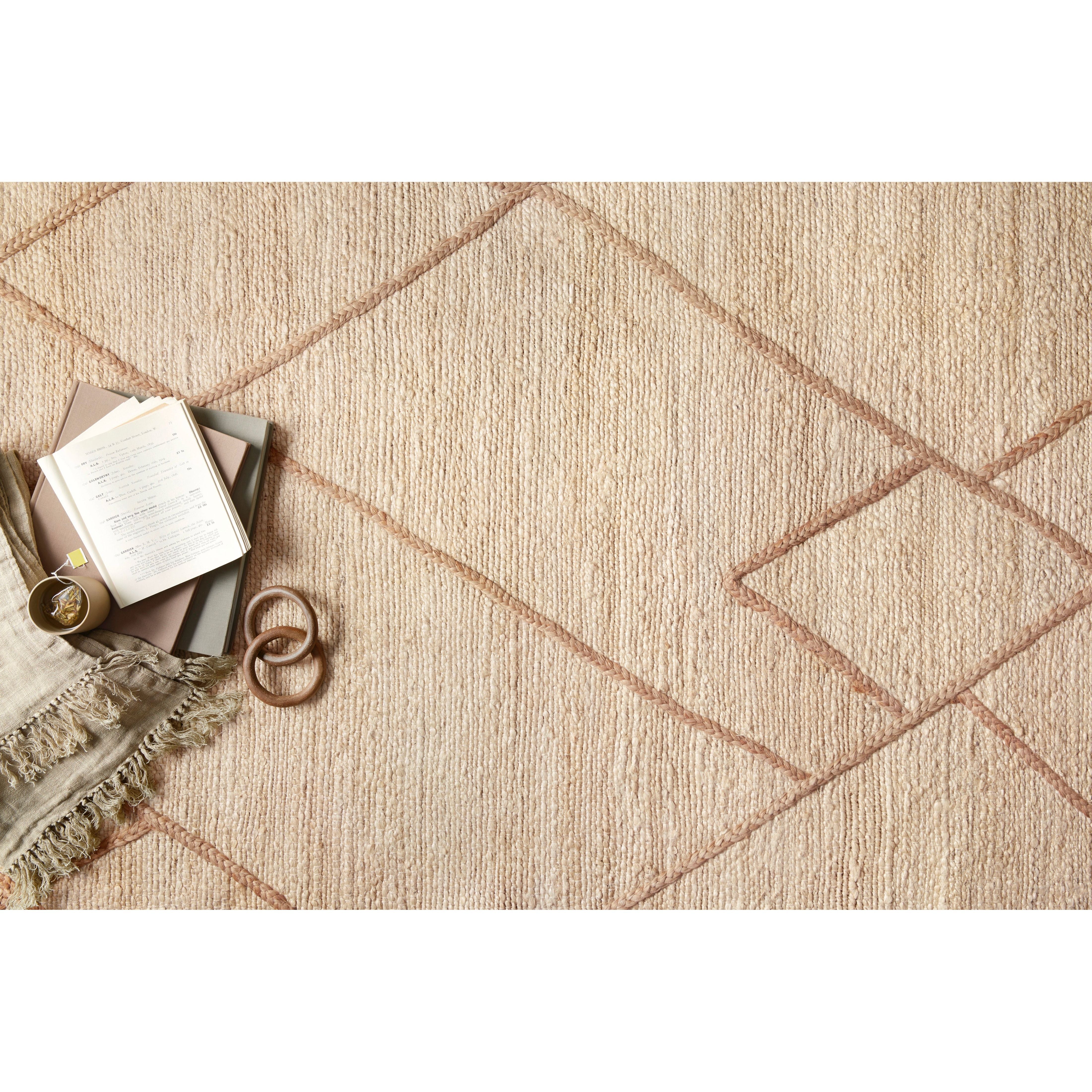 Featuring Bodhi Ivory / Natural BOD-01 Rug by Loloi at Amethyst Home. A tonal approach to Moroccan-inspired rugs, the Bodhi Ivory / Natural rug from Loloi is hand-woven of 100% jute by skilled artisans. This rug features linear and braided details, creating natural variations that make a subtle yet striking statement.
The Bodhi rug would be a great addition for an entryway, living ro. Amethyst Home provides interior design, new construction, custom furniture, and rugs for the Nashville metro area.