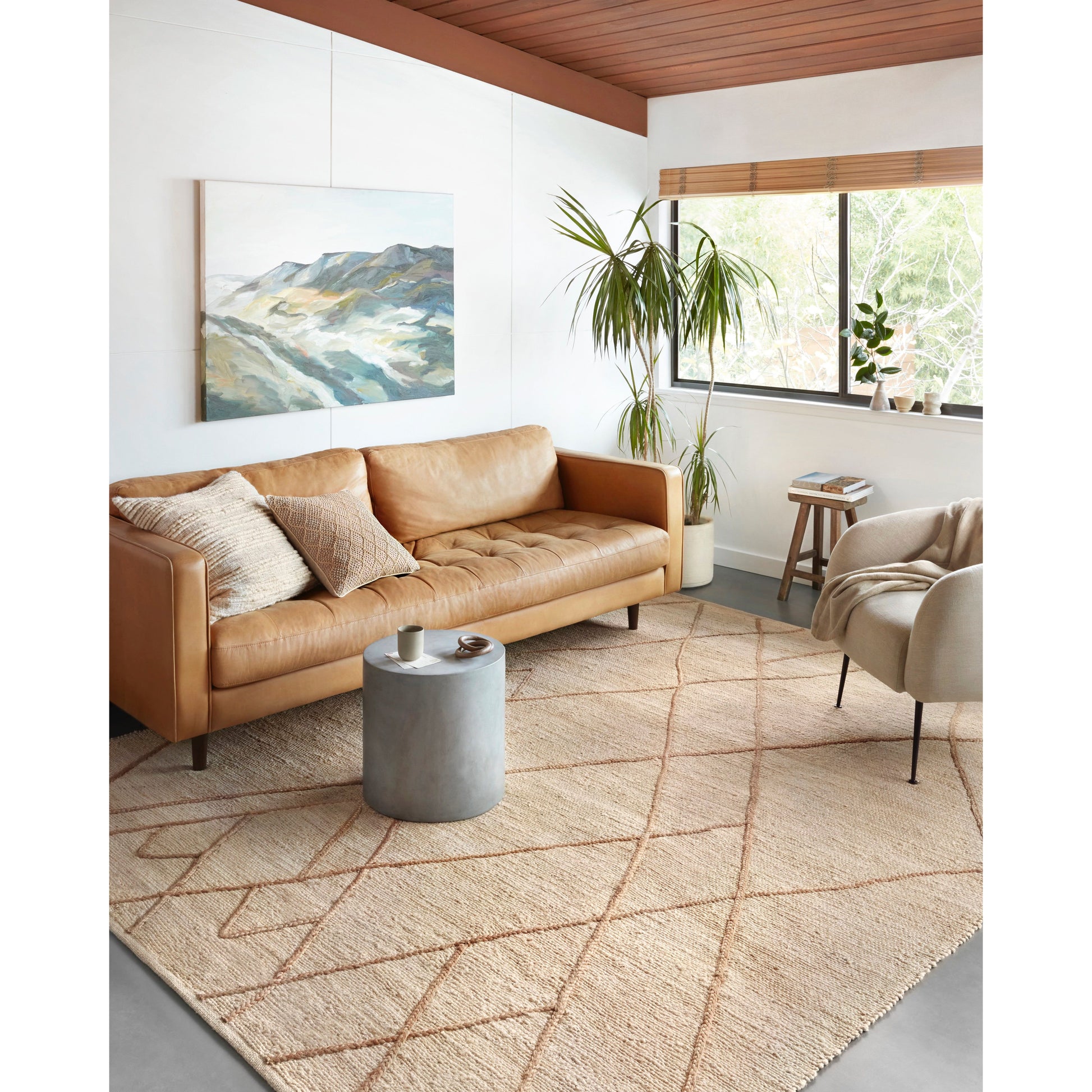 A tonal approach to Moroccan-inspired rugs, the Bodhi Ivory / Natural BOD-01 rug from Loloi is hand-woven of 100% jute. This rug features linear and braided details, creating natural variations that make a subtle yet striking statement for an entryway, living room, hallway or kitchen runner, or dining room. Amethyst Home provides interior design, new construction, custom furniture, and rugs for the Omaha and Lincoln, Nebraska metro area.