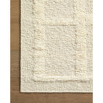 Featuring Cassian Ivory Rug by Loloi at Amethyst Home. The Cassian Ivory Rug is a hand-woven wool and cotton area rug with an asymmetrical gridded pattern and high-low texture. The rug’s higher, shaggy pile takes cues from Moroccan designs, while the neutral colors and natural materials make it a cozy addition to any space, especially living rooms and dens. T. Amethyst Home provides interior design, new home construction design consulting, vintage area rugs, and lighting in the Atlanta metro area.