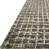 Featuring Giana Charcoal Rug by Loloi at Amethyst Home. Inspired by textural watercolors, the Giana Charcoal Rug from Loloi combines a relaxed grid with soft variations of grey and ivory for an effortless and sophisticated look. Each rug is hooked of 100% wool by artisans for a beautiful textural layer to your home. The soft textures of this rug bring warmth and coziness to any roo. Amethyst Home provides interior design, new construction, custom furniture, and rugs for the Kansas City metro area.