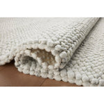 Featuring Jean Stoffer x Loloi Hendrick Ivory Rug by Loloi at Amethyst Home. The Hendrick Ivory Rug is a beautifully textured wool area rug with an elevated ease reminiscent of a cozy handmade sweater. The rug is very plush underfoot, making it equally welcome in bedrooms and living rooms. The hand-woven weave pattern adds dimension while the rug’s color palette is soft, neutral. Amethyst Home provides interior design, new construction, custom furniture, and area rugs in the Scottsdale metro area.