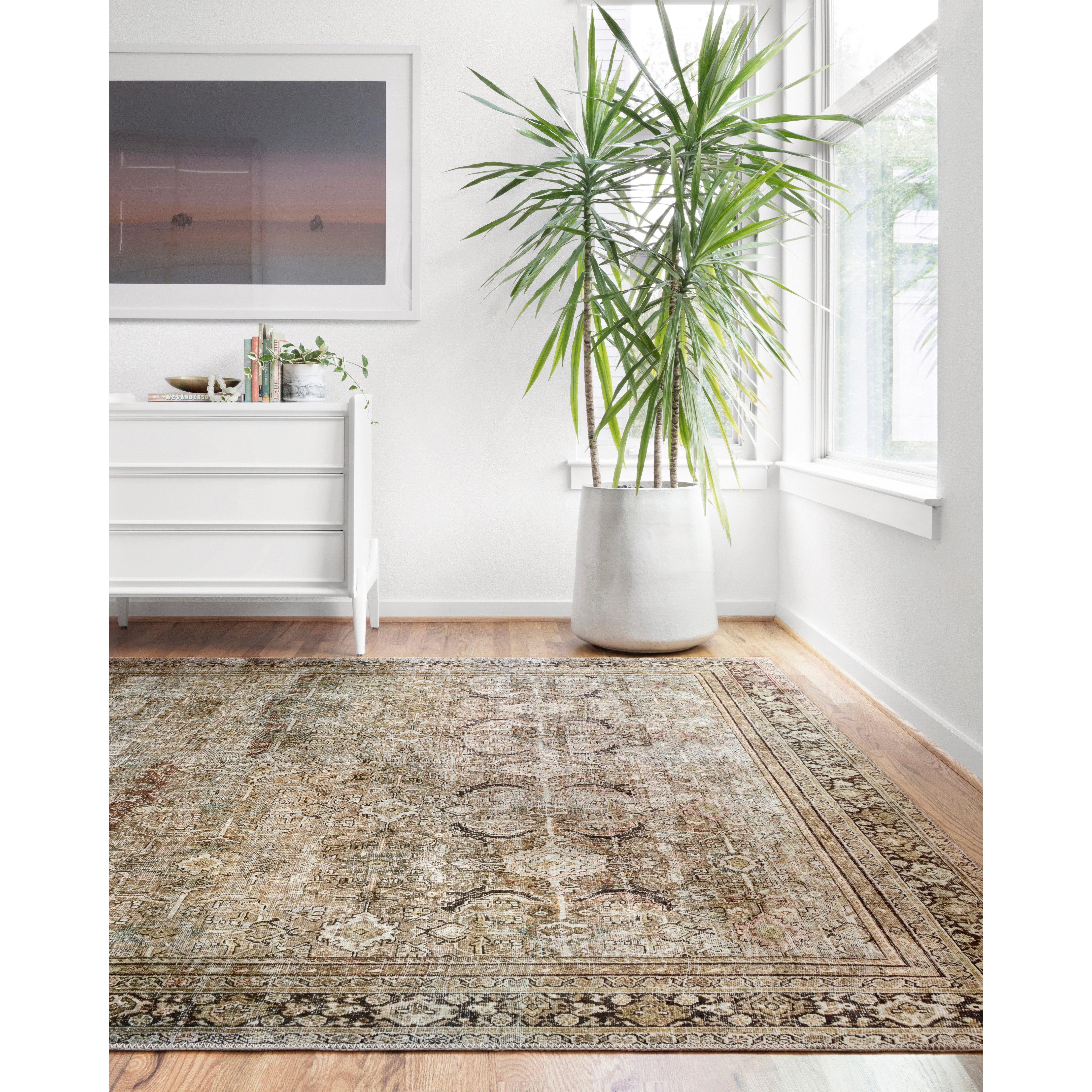 Perfect for families with kids and pets and very easy to clean and maintain. Comes in area, cute kitchen and hallway runner sizes. The rug is gorgeous with an intricate pattern and warms up the room with beautiful color tones. The Layla Olive/Charcoal LAY-03 rug from Loloi captures the spirit of an old-world rug. Amethyst Home provides interior design, new construction, custom furniture, and rugs for the Tampa, Winter Garden, Winter Park, and Orlando metro area.