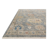 The Legacy Blue / Multi LZ-10 Rug from Loloi is hand-knotted, refined, yet versatile for hallways, living rooms, bedrooms, and extra large spaces. The Legacy rug is deliberately distressed and sheared down to an extra low pile of 100% wool, creating a patina usually only imparted through decades of wear. Amethyst Home provides interior design, new construction, custom furniture, and rugs for the Columbus and Canton, Ohio metro area.