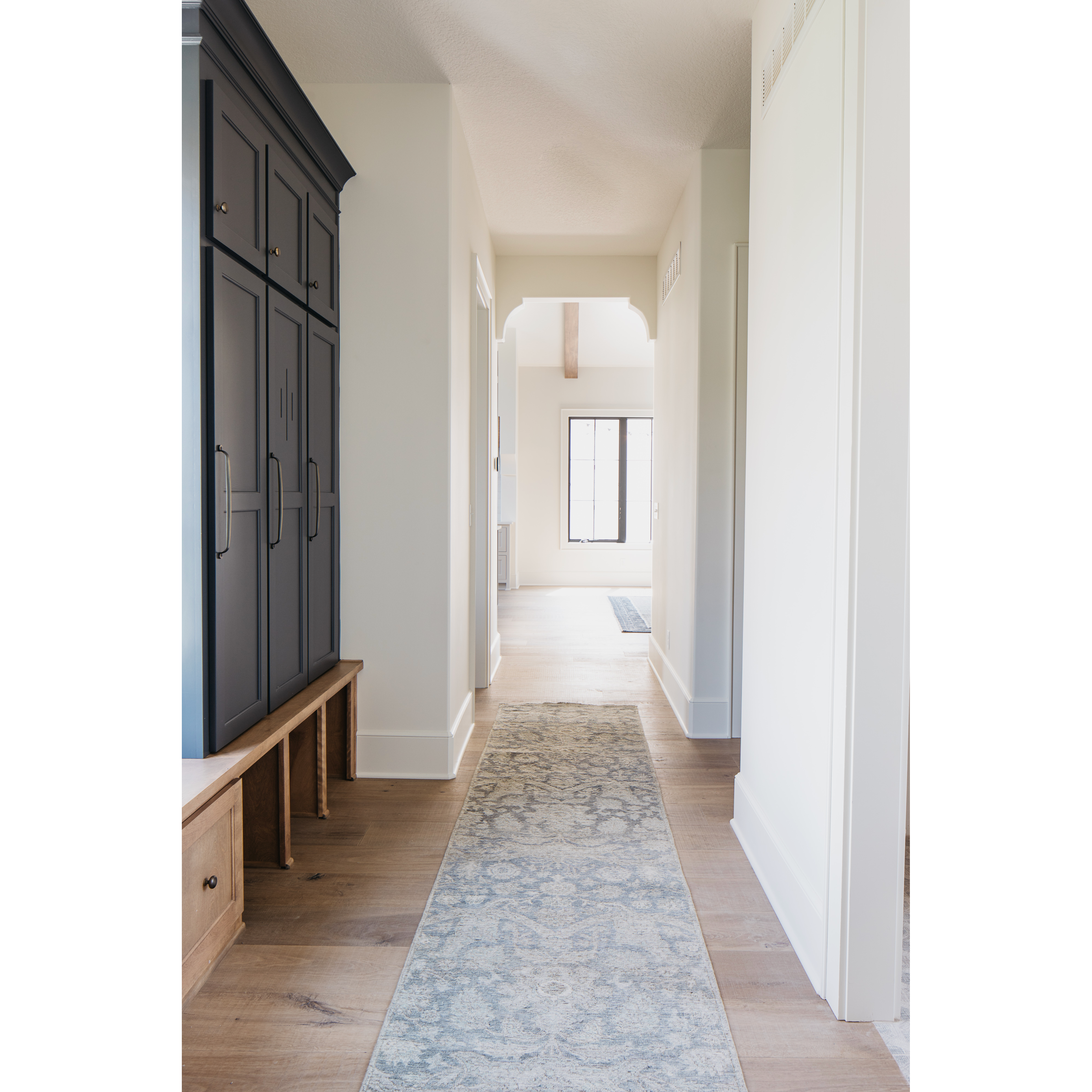 The Legacy Storm area rug from Loloi has been deliberately distressed and sheared down to an extra low pile, creating a patina usually only imparted through decades of wear. Perfect for living rooms, hallways, and bedrooms. Easy to clean and maintain. Looks gorgeous with the intricate pattern and patina. Amethyst Home provides interior design services for the Kansas City, Omaha, and Des Moines metro areas.