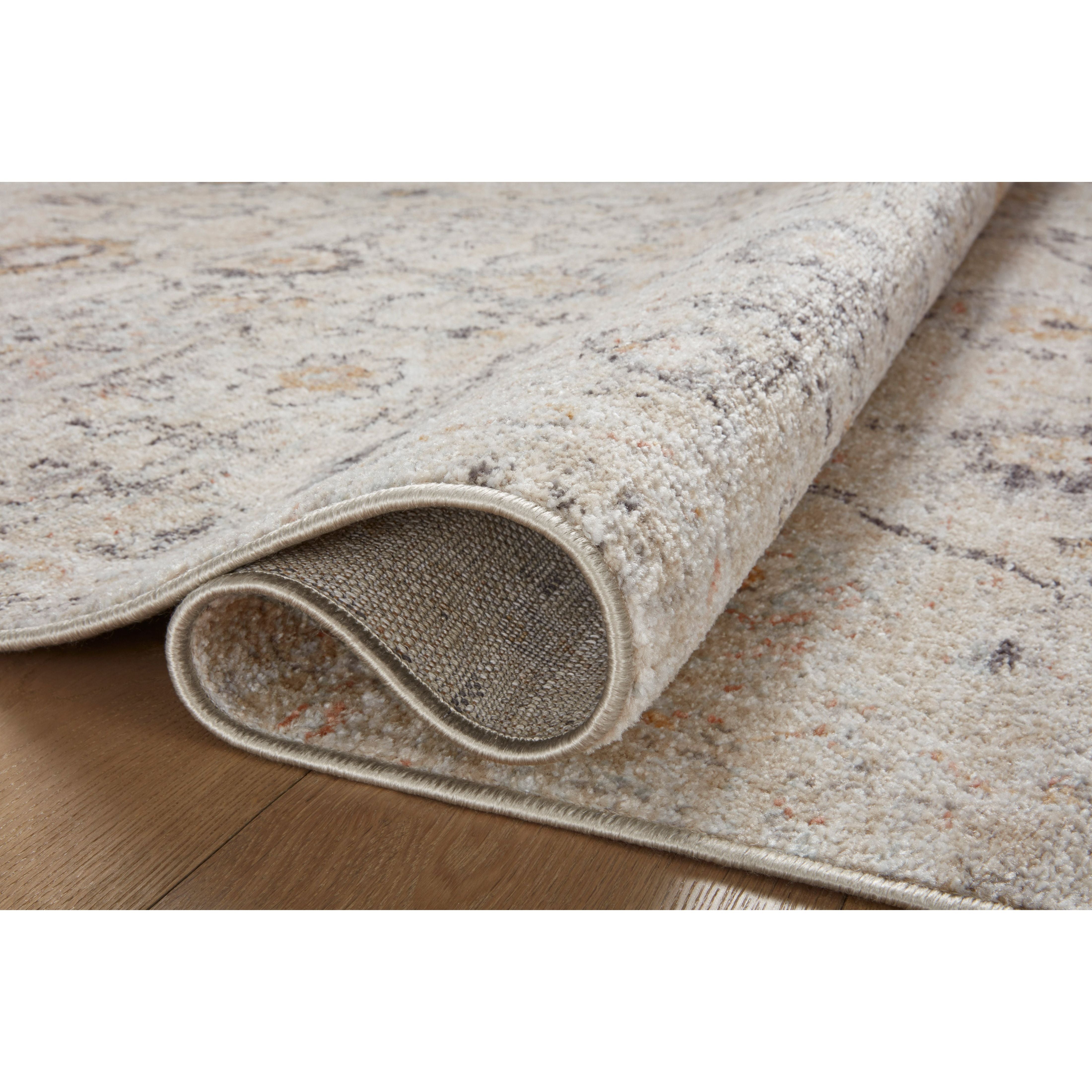 Featuring Monroe Natural / Multi Rug by Loloi at Amethyst Home. Inspired by antique Turkish Oushak carpets with large-scale motifs, the Monroe Natural / Multi Rug modernizes the traditional design in neutral palettes, many of which have black details that anchor the rug in the room. Monroe is power-loomed of 100% polypropylene for easy care and reliable dur. Amethyst Home provides interior design, new home construction design consulting, vintage area rugs, and lighting in the Nashville metro area.