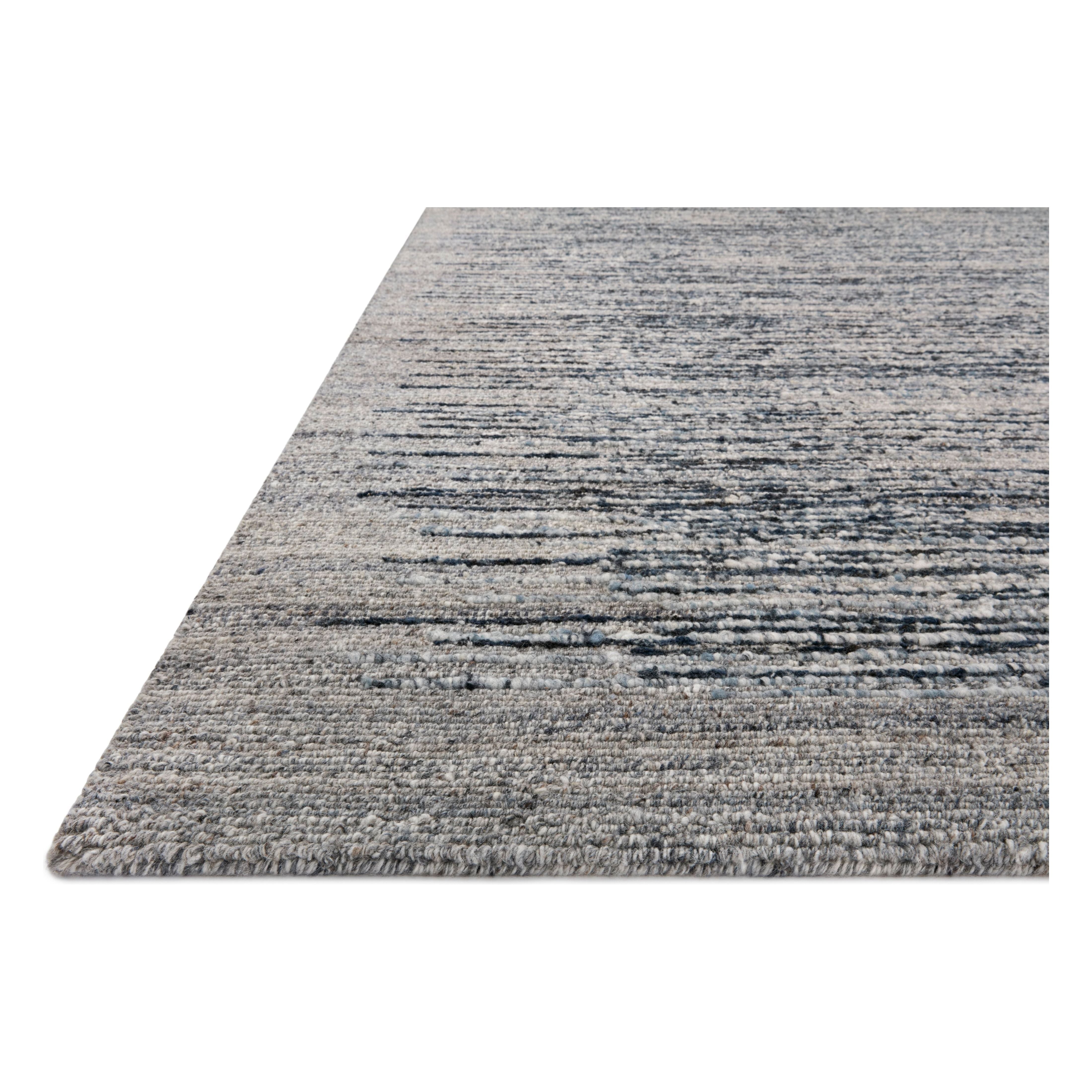 Featuring Raquel Denim / Grey Rug by Loloi at Amethyst Home. The Raquel Collection exemplifies what makes a hand-knotted rug so unique. Each area rug has a ribbed texture and subtle striping created by the artisan’s cut-and-loop technique. Raquel features an organic, asymmetrical linear pattern in an airy, neutral palette. With both an elevated look and fe. Amethyst Home provides interior design, new home construction design consulting, vintage area rugs, and lighting in the Washington metro area.