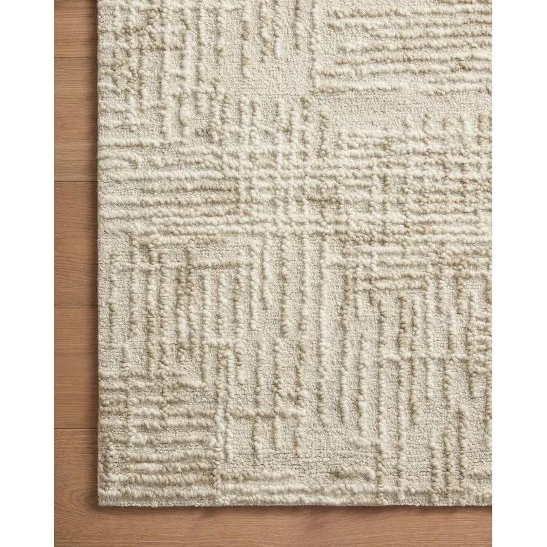 Hand-crafted with a combination of thick and fine yarns, the Tallulah Natural / Sage Rug area rug creates dynamic dimension in living rooms, bedrooms, and more. The thicker yarns define the abstract, linear design, giving the rug a distinct high-low texture and sense of movement. Amethyst Home provides interior design, new home construction design consulting, vintage area rugs, and lighting in the Washington metro area.