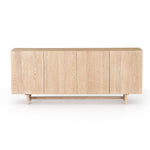 We love the grained matte finish on this Mika Washed Oak Veneer Dining Sideboard. The shelves make this the perfect sideboard for a functional, modernly attractive piece to add to your dining room  Size:  72.00"w x 16.00"d x 30.00"h Materials: Oak Veneer