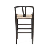 Featuring Muestra Counter + Bar Stool - Black Teak by Four Hands at Amethyst Home. Modern curves redefine the classic wishbone-style of this Muestra Black Teak Counter + Bar Stool. Vintage white all-weather wicker is woven for a dose of fresh texture within weathered grey teak framing. Cover or store indoors during inclement weather and when not in use.
Counte. Amethyst Home provides interior design, new home construction design consulting, vintage area rugs, and lighting in the Boston metro area.