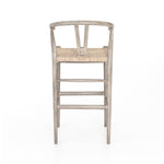 Modern curves redefine the classic wishbone-style counter stool. Vintage white all-weather wicker is woven for a dose of fresh texture within weathered grey teak framing. Cover or store indoors during inclement weather and when not in use. Amethyst Home provides interior design, new home construction design consulting, vintage area rugs, and lighting in the Alpharetta metro area.