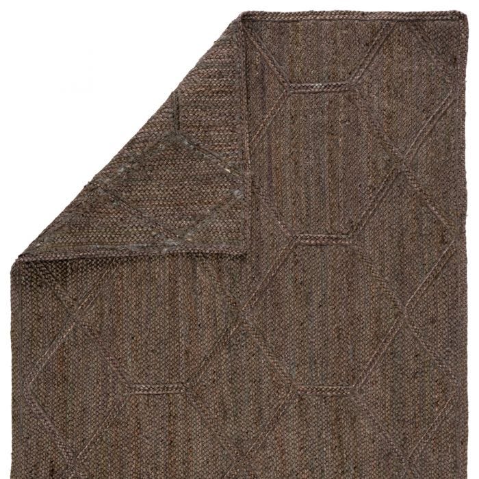 Featuring Naturals Tobago Ponce Rug by Jaipur Living at Amethyst Home. The Naturals Tobago collection delivers rich texture and organic allure to contemporary homes. Handwoven of jute, the Ponce area rug showcases a chic geometric trellis design. The mix of gray, taupe, and brown hues lend a deep natural tone to ground any space.
Handwoven 100% Jute NAT42 Na.  Amethyst Home provides interior design, new home construction design consulting, vintage area rugs, and lighting in the Houston metro area.