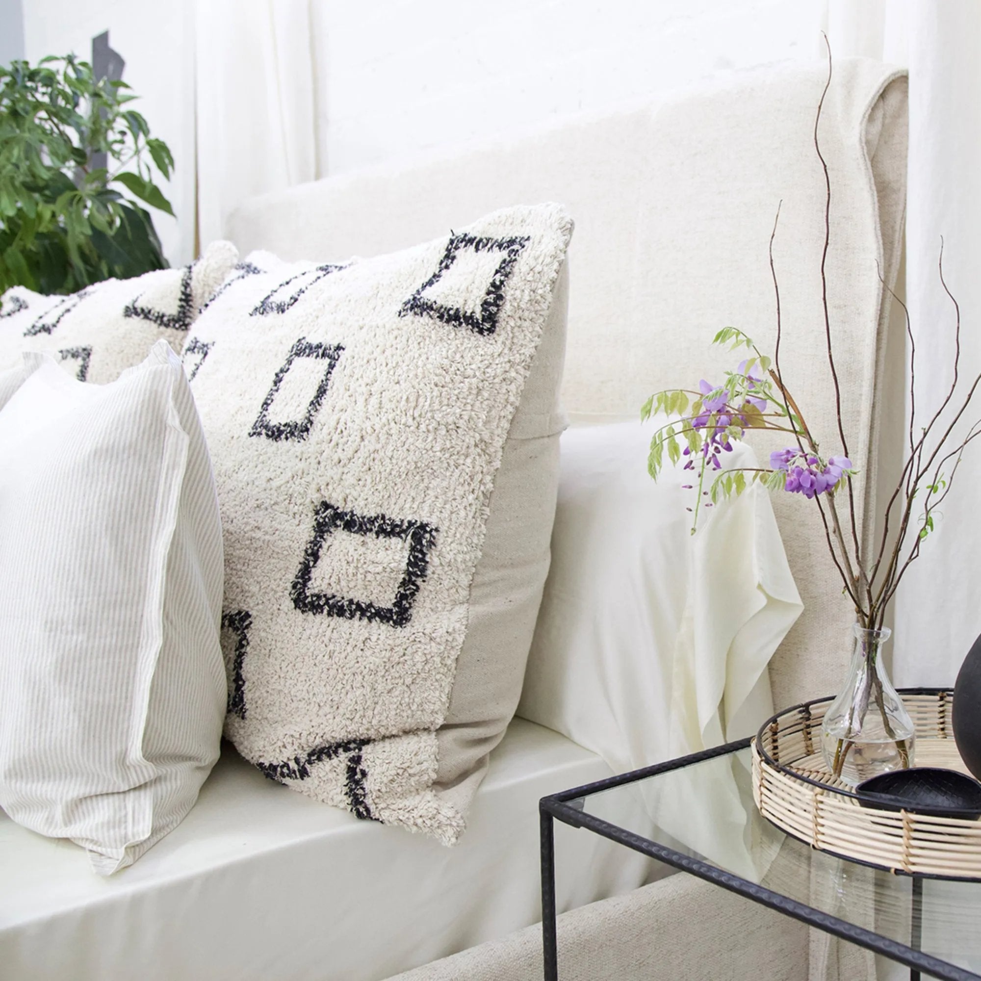 Soft and plush this oversized, hand-woven shag pillow adds a touch of boho to your bedroom or home. Featuring a repeating pattern of charcoal boxes, this pillow is one of our most popular items ever Amethyst Home provides interior design, new home construction design consulting, vintage area rugs, and lighting in the Austin metro area.