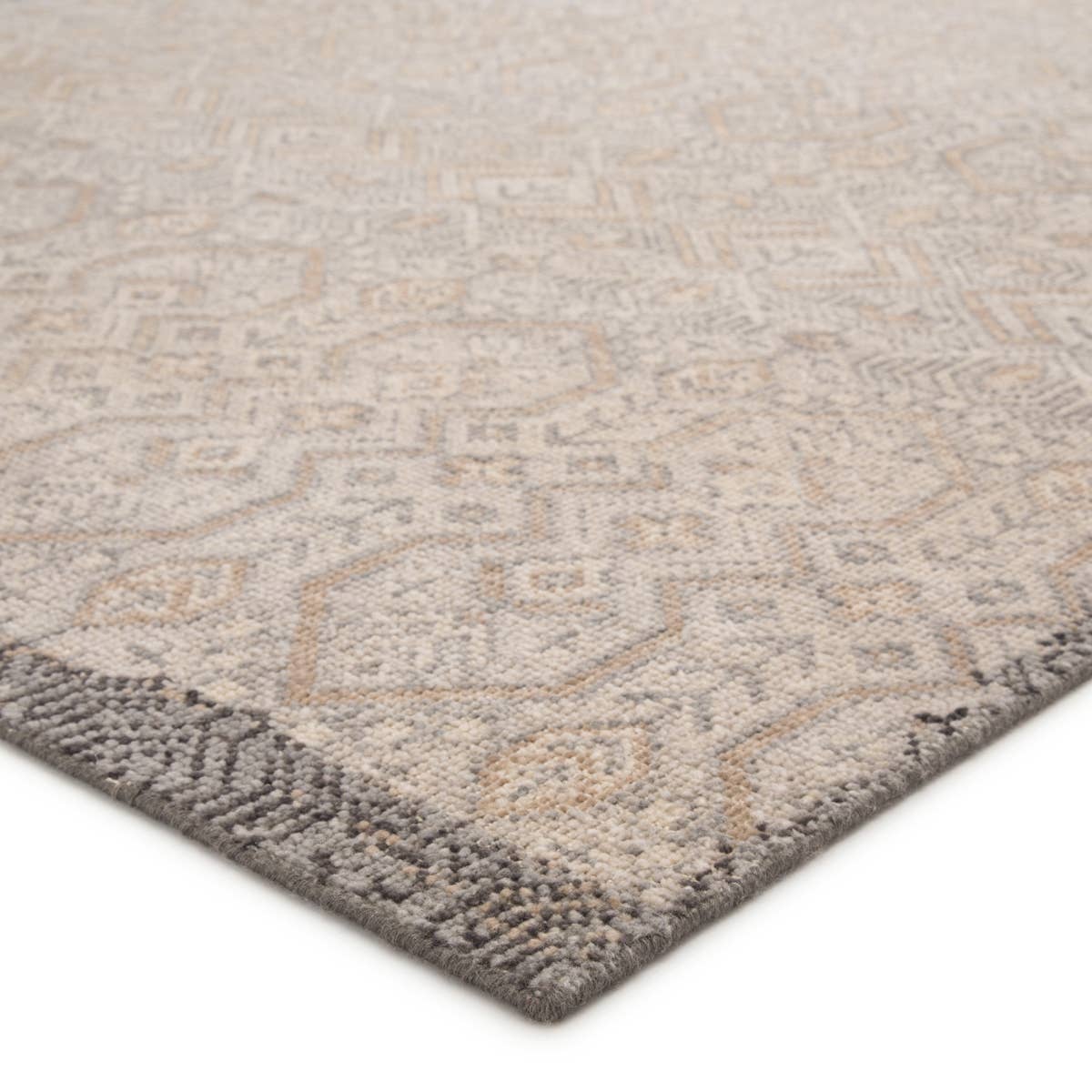 Featuring Revolution Prospect Hand-Knotted Rug by Jaipur Living at Amethyst Home. The Revolution collection is inspired by traditional style and beautifully detailed antique textile designs. The hand-knotted Prospect area rug showcases a captivating geometric design in muted tones of gray and gold. A charcoal edge creates a unique border effect around .  Amethyst Home provides interior design, new home construction design consulting, vintage area rugs, and lighting in the Winter Garden metro area.