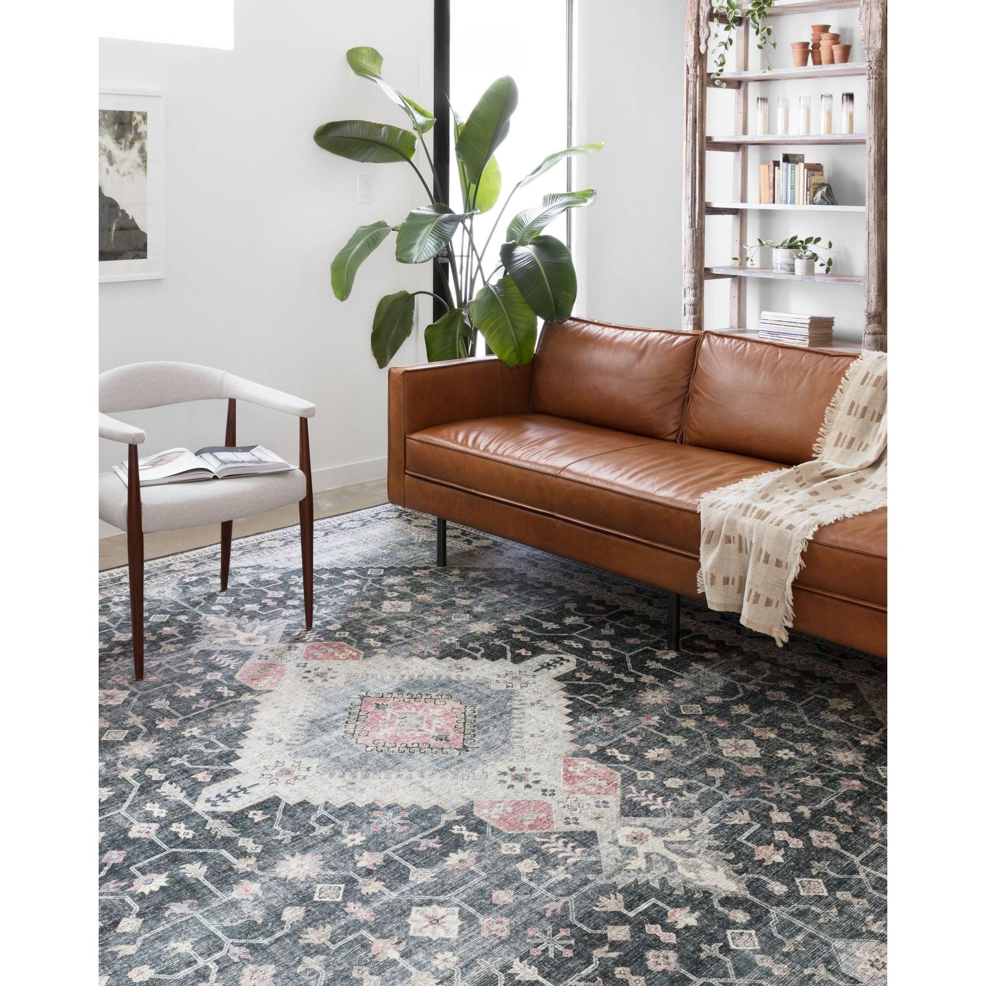 Perfect for families with kids and pets and very easy to clean and maintain. Comes in area, cute kitchen and hallway runner sizes. The rug is gorgeous with an intricate pattern and warms up the room with beautiful color tones. The Skye Charcoal/Multi SKY-02 rug from Loloi captures the spirit of an old-world rug.
