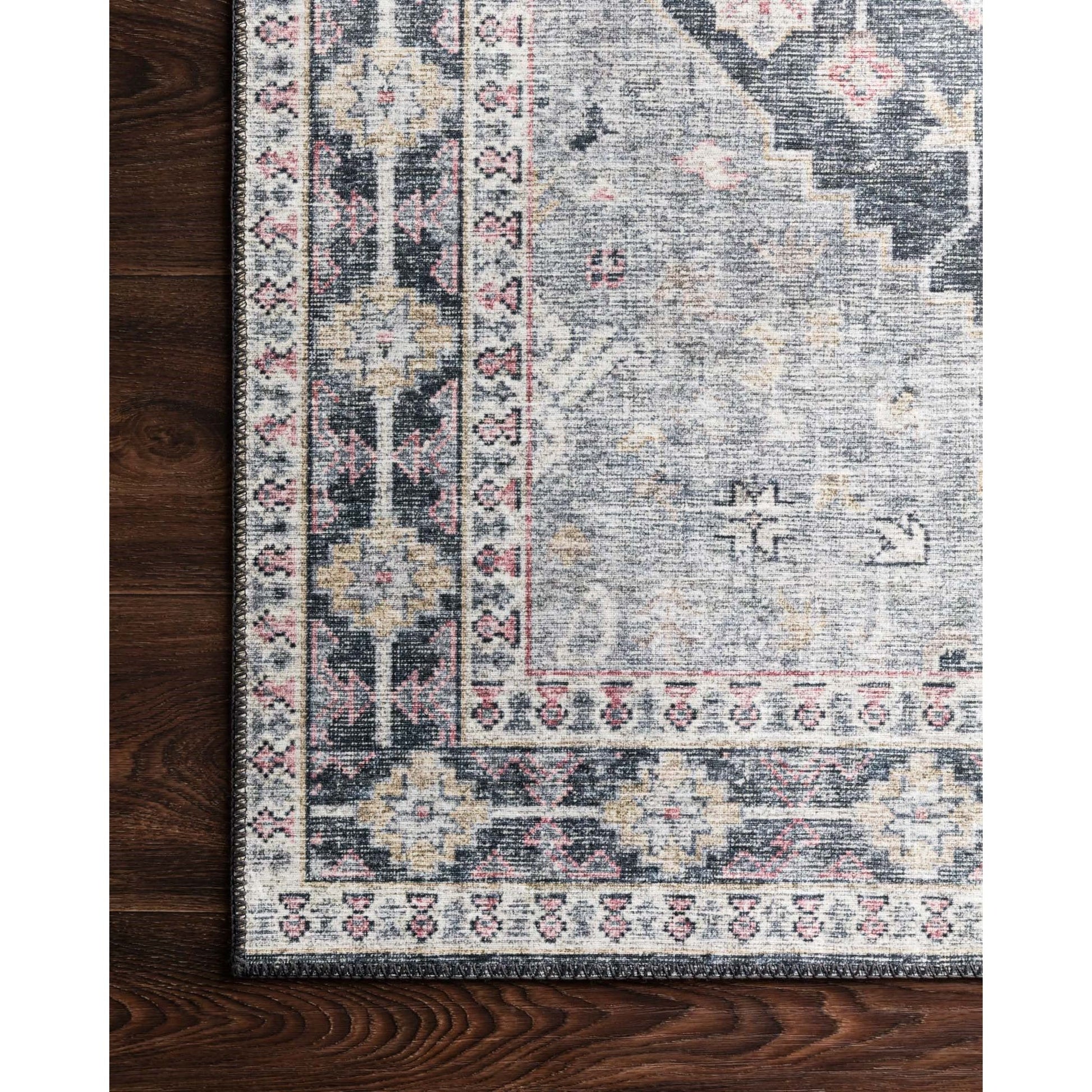 Perfect for families with kids and pets and very easy to clean and maintain. Comes in area, cute kitchen and hallway runner sizes. The rug is gorgeous with an intricate pattern and warms up the room with beautiful color tones. The Skye Charcoal/Multi SKY-02 rug from Loloi captures the spirit of an old-world rug.