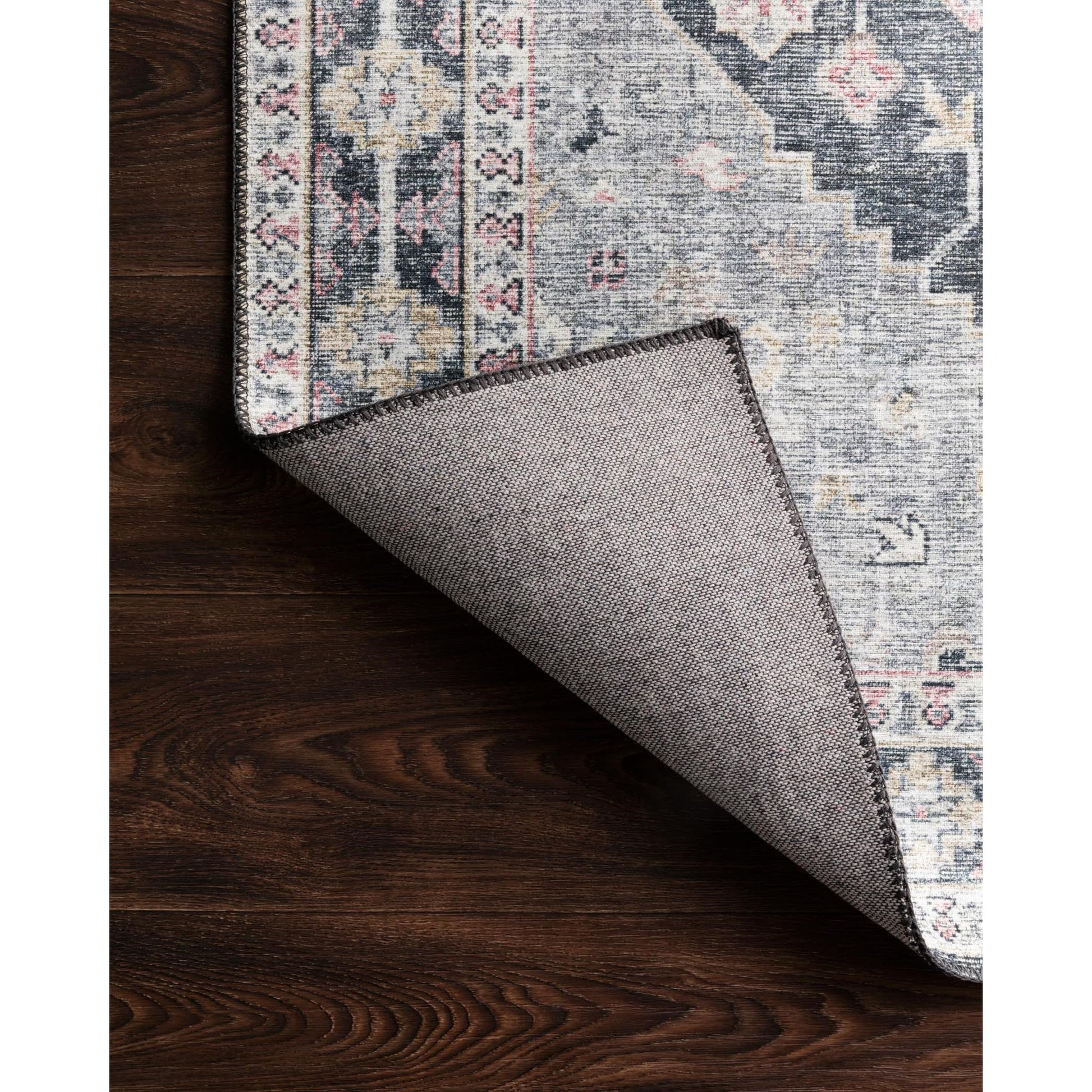 Perfect for families with kids and pets and very easy to clean and maintain. Comes in area, cute kitchen and hallway runner sizes. The rug is gorgeous with an intricate pattern and warms up the room with beautiful color tones. The Skye Charcoal/Multi SKY-02 rug from Loloi captures the spirit of an old-world rug.