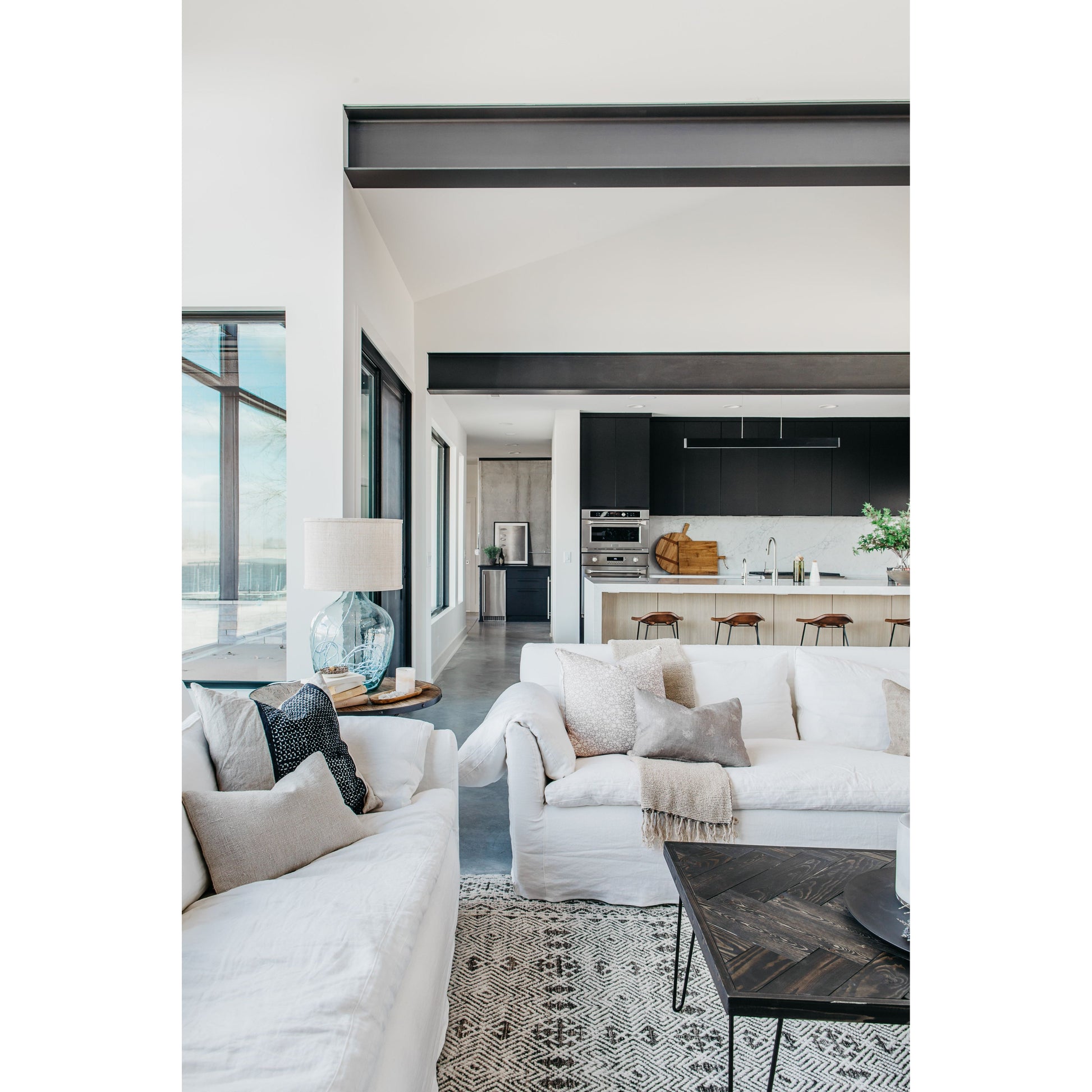 This cozy Donato Sofa from Cisco Brothers is our favorite! As shown slipcovered in Mariet White 100% linen fabric. Amethyst Home provides interior design, new home construction design consulting, vintage area rugs, and lighting in the Charlotte metro area.
