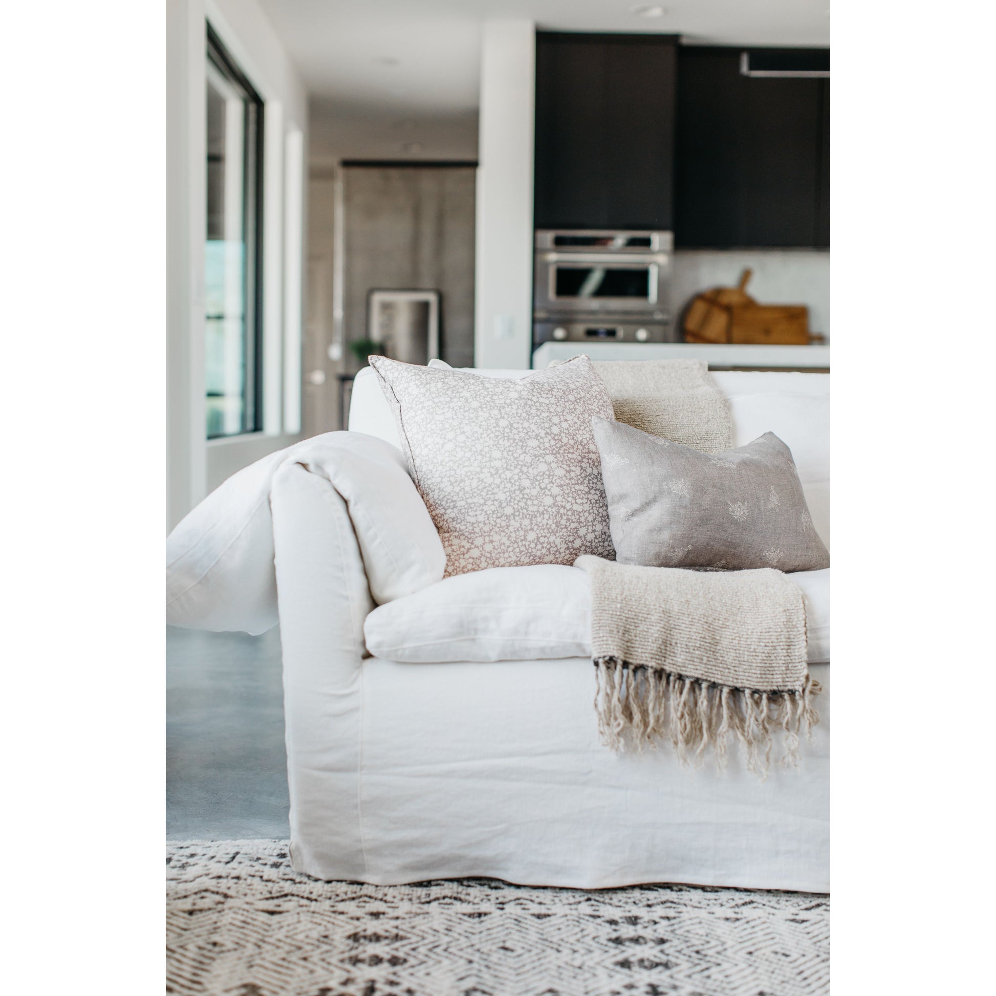 This cozy Donato Sofa from Cisco Brothers is our favorite! As shown slipcovered in Mariet White 100% linen fabric. Amethyst Home provides interior design, new home construction design consulting, vintage area rugs, and lighting in the Nashville metro area.