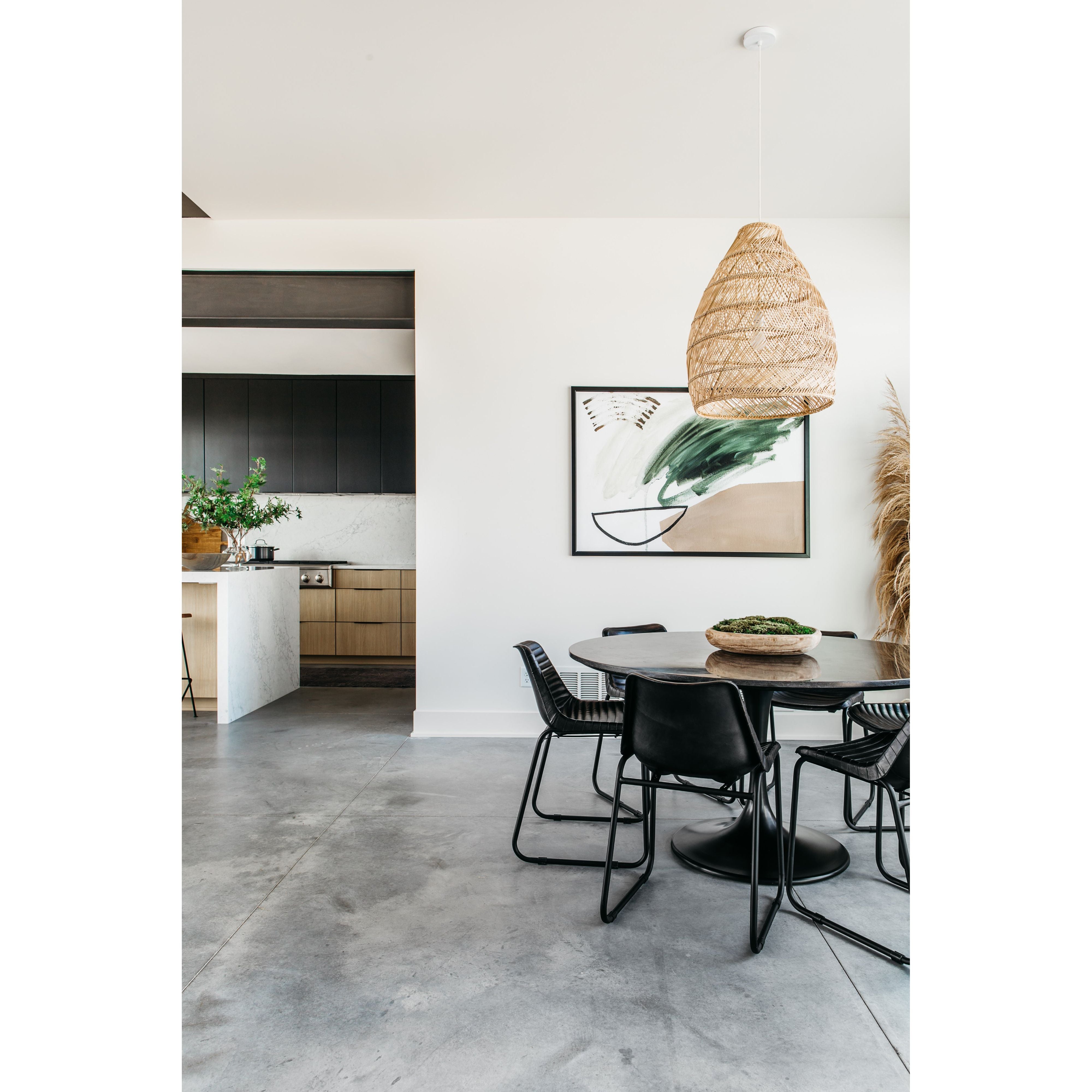 Classic tulip shaping is recast with a rustic black iron finish topped with a solid bluestone table top. This cute bistro style dining table is perfectly sized for a cozy breakfast nook.  Size: 55.00"w x 55.00"d x 29.50"h