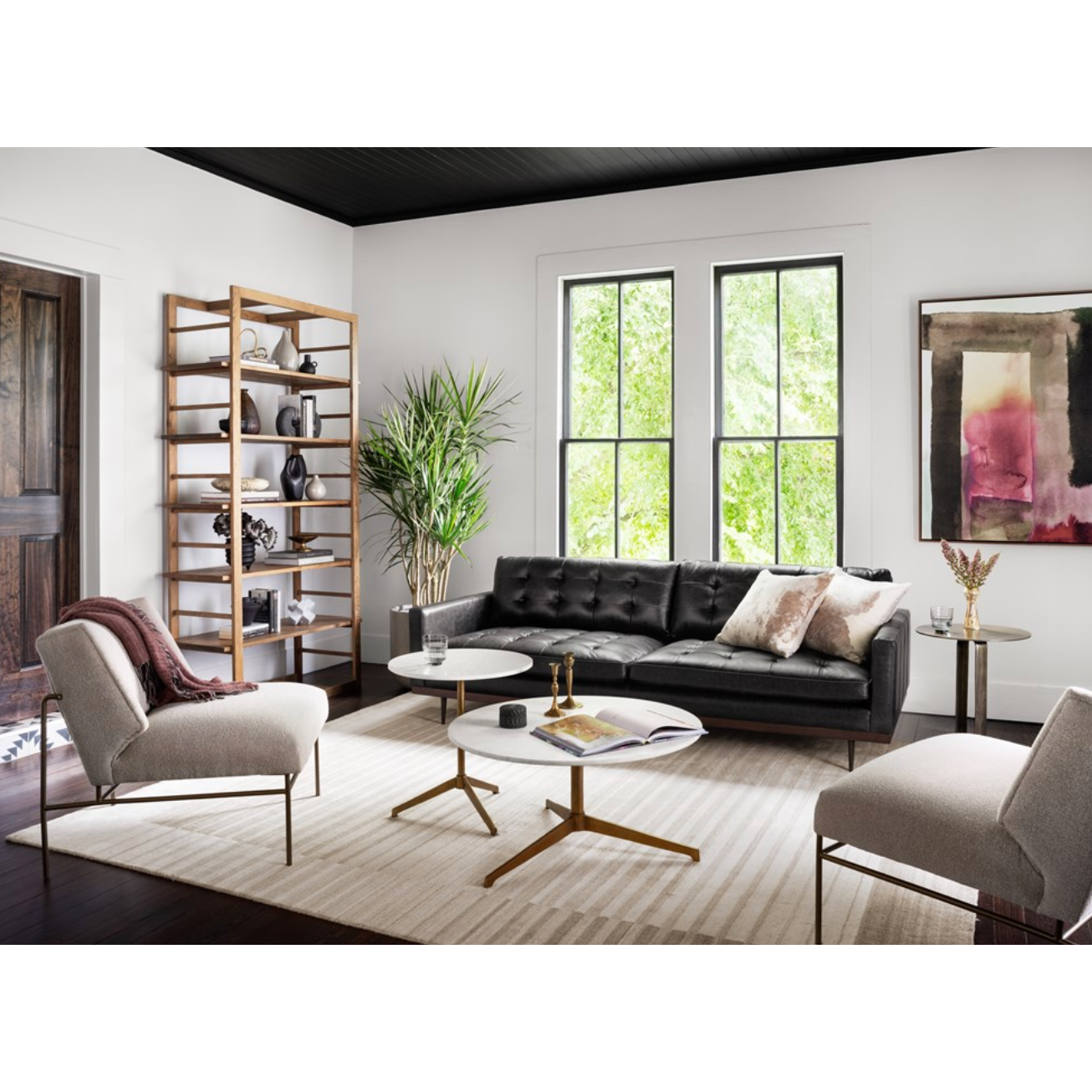 Simple, sophisticated style. The Helen Round Coffee Table has a slim tripod base of raw brass supports a rounded tabletop of polished white marble. Petite scale perfect for smaller spaces or rooms with a sectional.