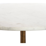 Featuring Helen Round Coffee Table by Four Hands at Amethyst Home. Simple, sophisticated style. The Helen Round Coffee Table has a slim tripod base of raw brass supports a rounded tabletop of polished white marble. Petite scale perfect for smaller spaces or rooms with a sectional.
Overall Dimensions: 32"W x 32"L x 16.50"H

Colors: Raw Brass, Polished White.  Amethyst Home provides interior design, new home construction design consulting, vintage area rugs, and lighting in the San Diego metro area.