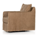 The Freddy Leather Swivel Chair is a slipcovered, leather swivel chair -- perfect for moody rooms. The chair features a comfortable, plush back and supportive seat. Please expect natural distressing. Amethyst Home provides interior design, new home construction design consulting, vintage area rugs, and lighting in the Winter Garden metro area.