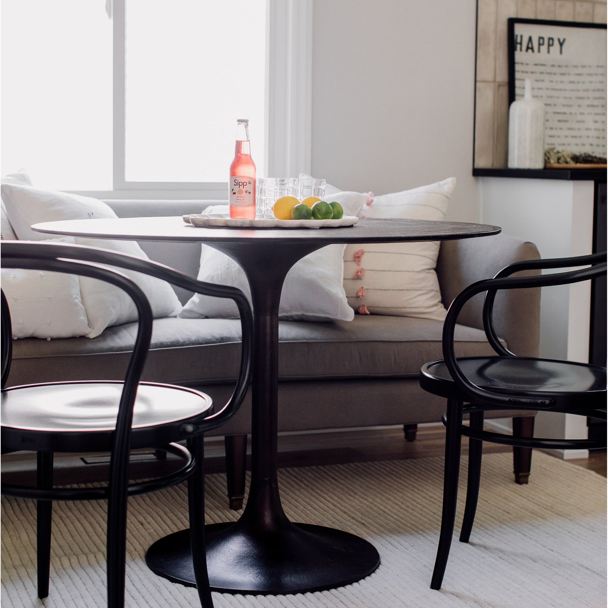 Classic tulip shaping in textural cast-aluminum makes for a modern Simone Antique Rust Bistro Table. Finished in antique rust to bring out alluring highs and lows. Amethyst Home provides interior design, new home construction design consulting, vintage area rugs, and lighting in the Seattle metro area.